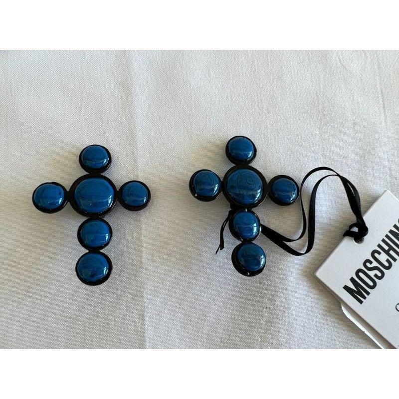 SS20 Moschino Couture Jeremy Scott Picasso Blue Cross Clip On Earrings

Additional Information:
Material: Metal
Color: Blue
Pattern: Cross
Style: Clip
Dimensions: 2.5