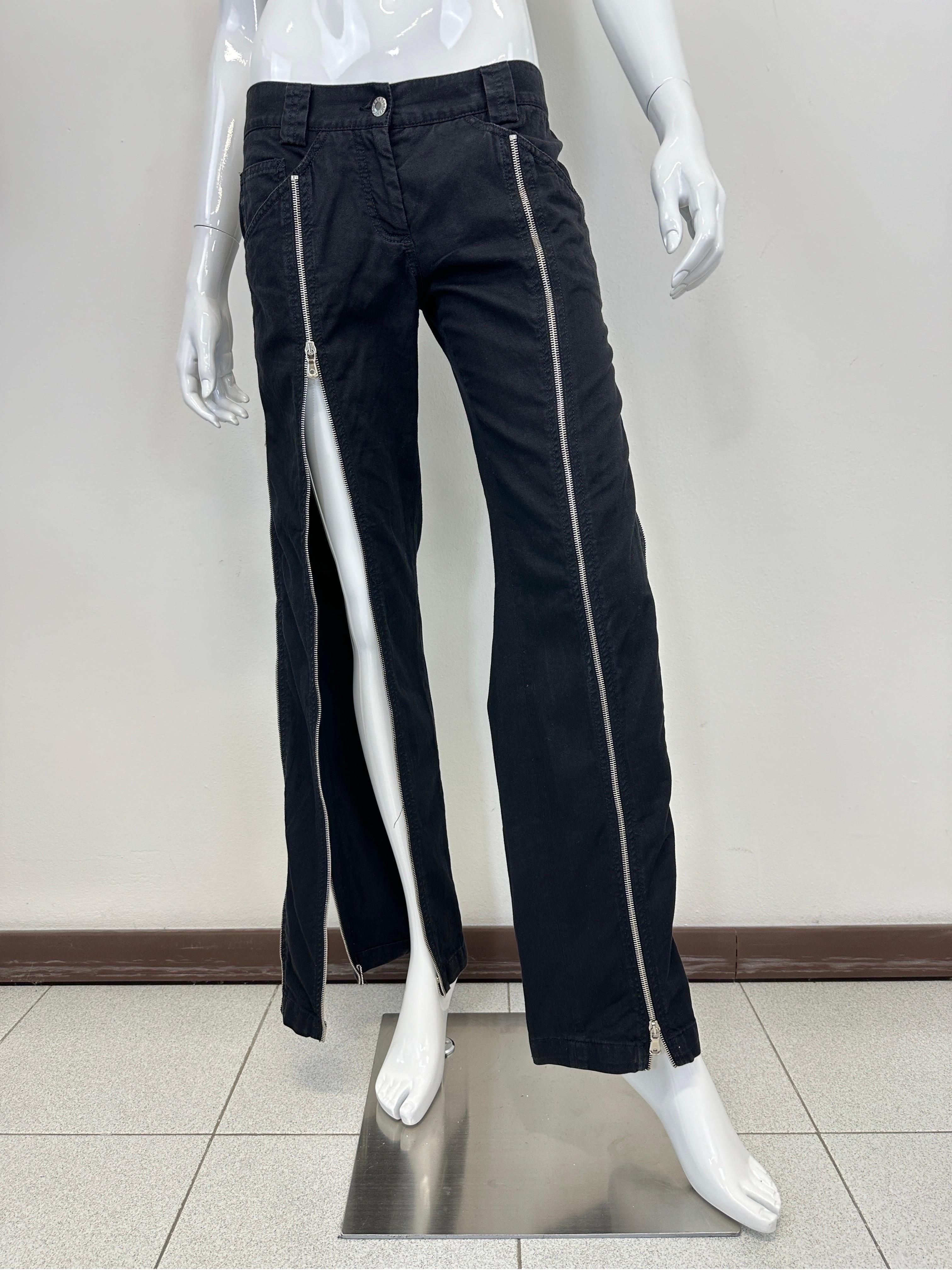 Vintage Dolce & Gabbana mainline item from Summer 2003, one of the most iconic seasons featured with the Sex and Love accessories. These pants feature 4 full leg zippers that you can fully open and wear the pants in hundreds of different ways. 5