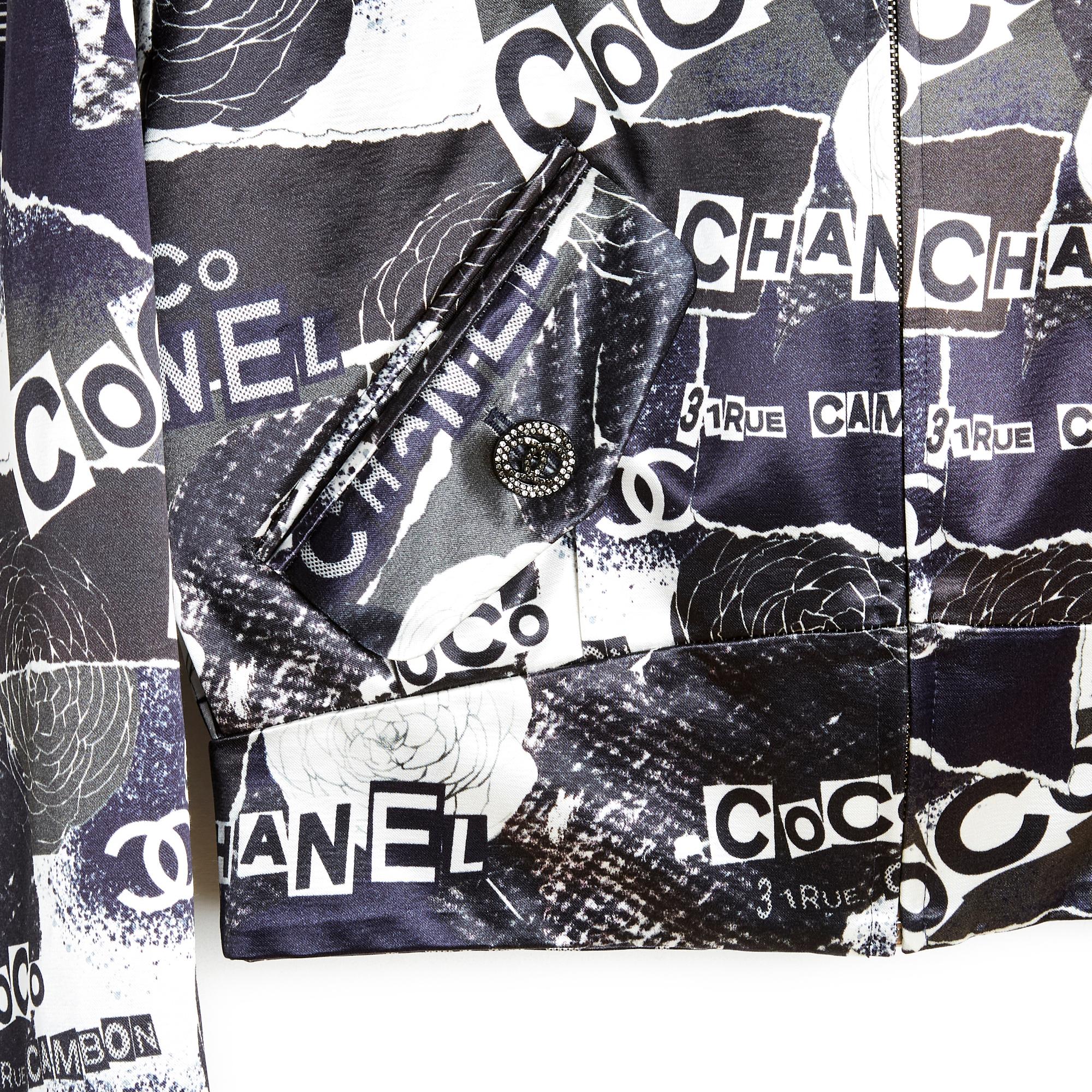 Chanel jacket SS2020 collection, short bomber style jacket in cotton blend satin with black and white Coco Cambon Camélia print, front closure with a long zip, 2 slanted flap pockets closed with a CC logo button and paved with mini matte rhinestones