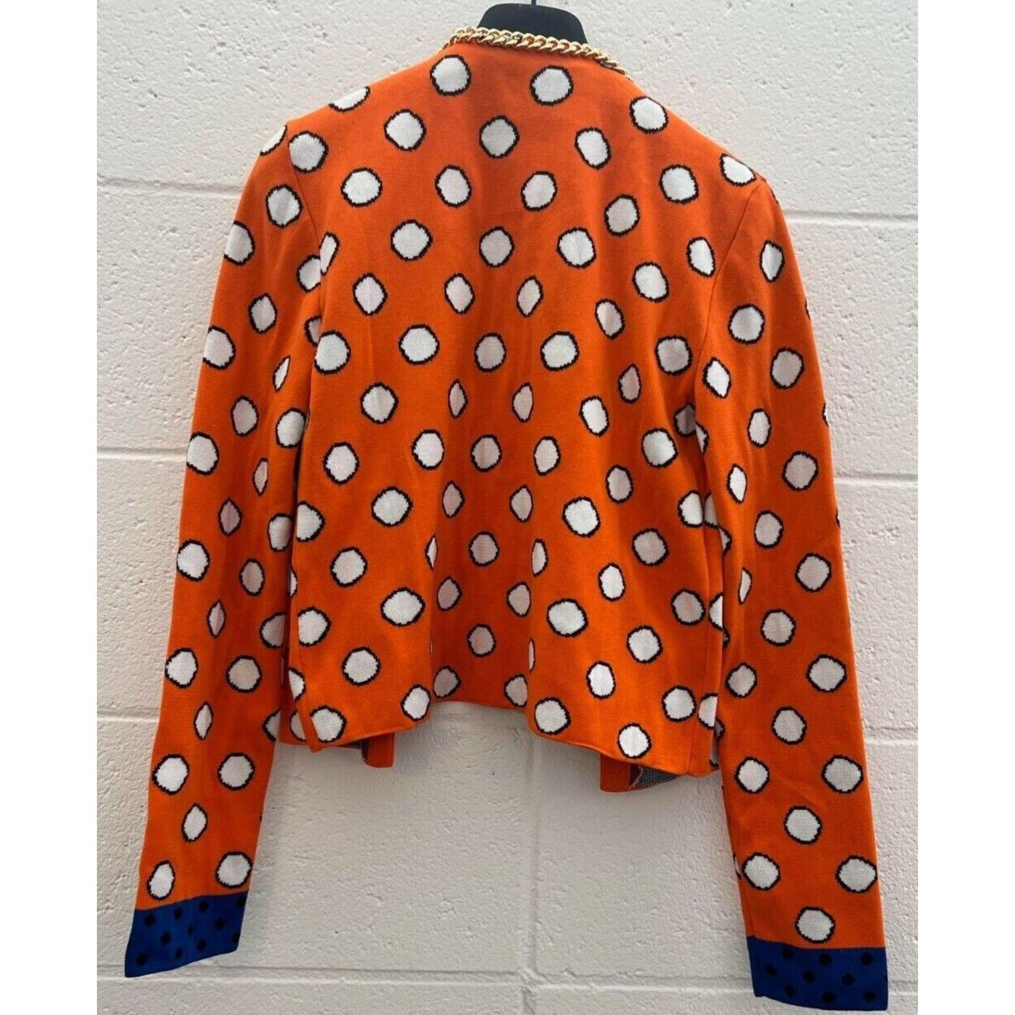 SS21 Moschino Couture Jeremy Scott Orange Cardigan White Circles and Logo Charm

Additional Information:
Material: 100% Cotton
Color: Orange, White, Black, Blue
Size: IT 40 / US 6
Pattern: Allover large white polka dot
Style: Cardigan
Dimensions: