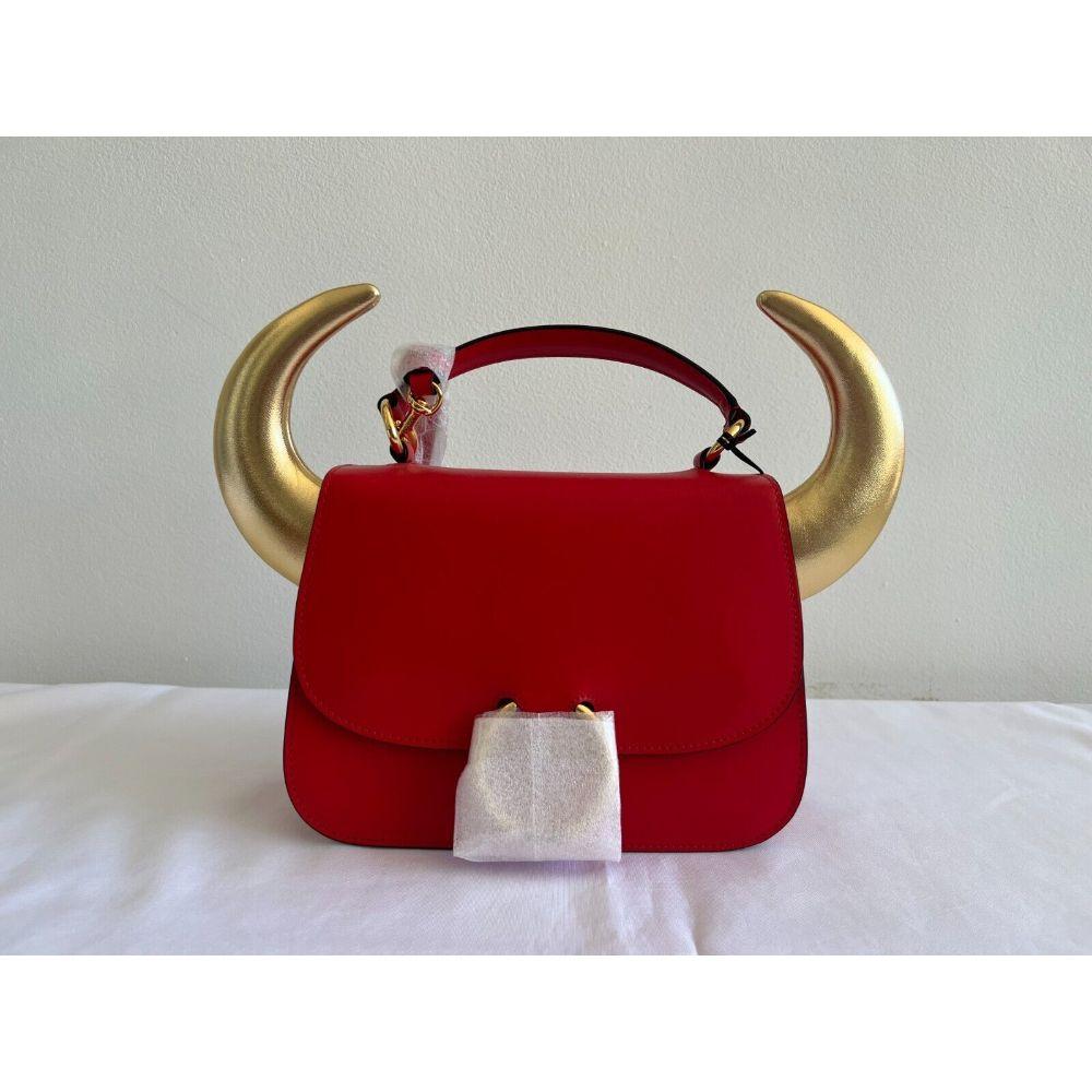 SS21 Moschino Couture Jeremy Scott RED Bullchic Horn-Detail Leather Shoulder Bag

Additional Information:
Material: 100% Leather
Color: Red, Gold
Size: Medium
Pattern: Solid, Horns Detailed
Style: Shoulder Bag
Dimensions: 9