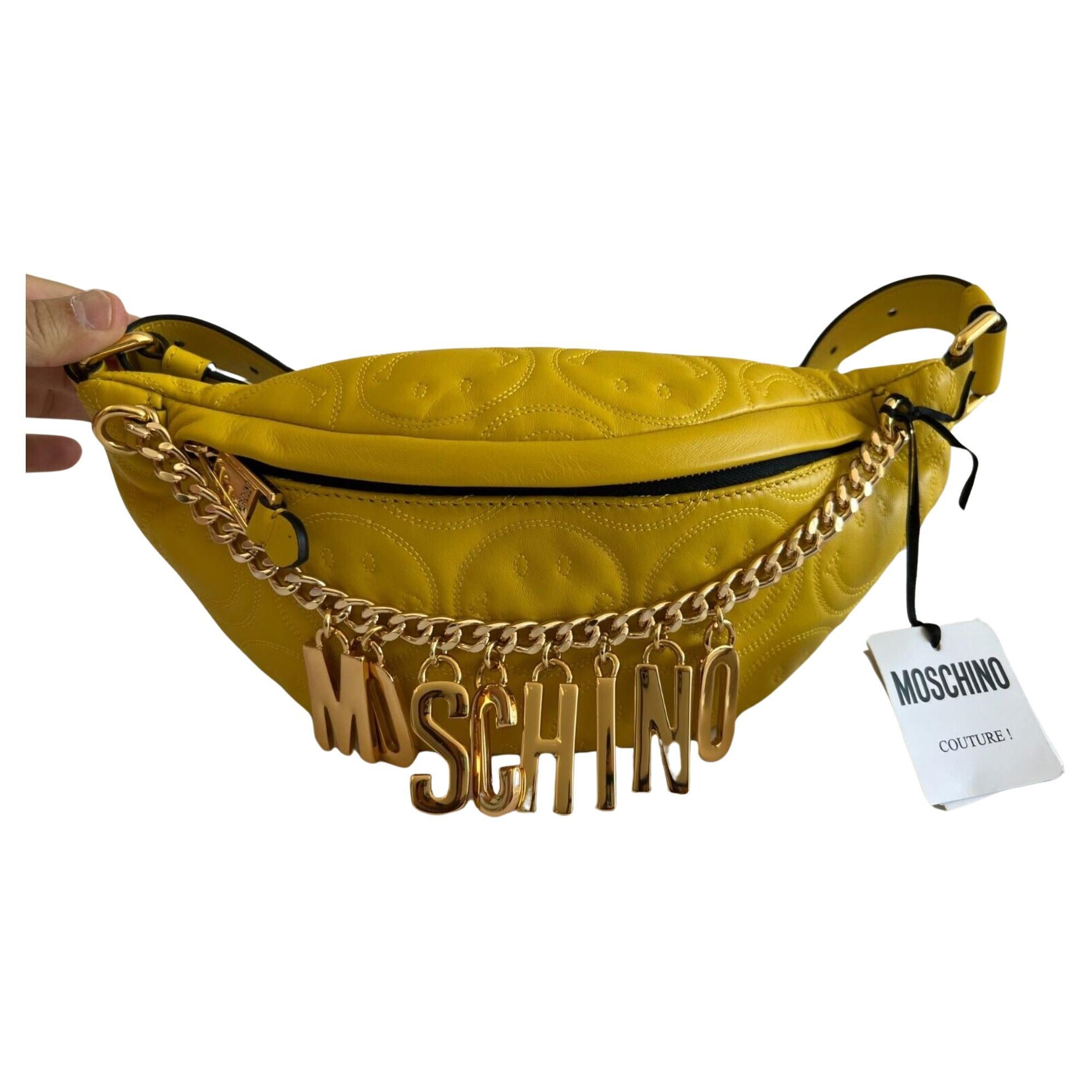 SS21 Moschino Couture Jeremy Scott Yellow Leather Fanny Pack w/ Engraved Smiley

Additional Information:
Material: Leather
Color: Yellow, Black
Size: Medium
Pattern: Smiley
Style: Belt Bag
Dimensions: H: 4