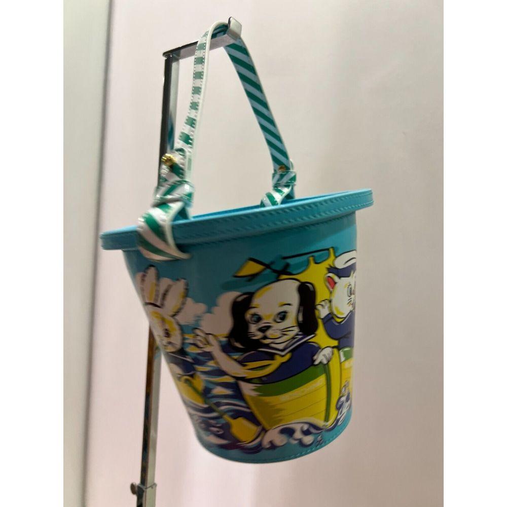 SS22 Moschino Couture Child's Fantasy Sand Bucket Top Handle Bag by Jeremy Scott For Sale 6