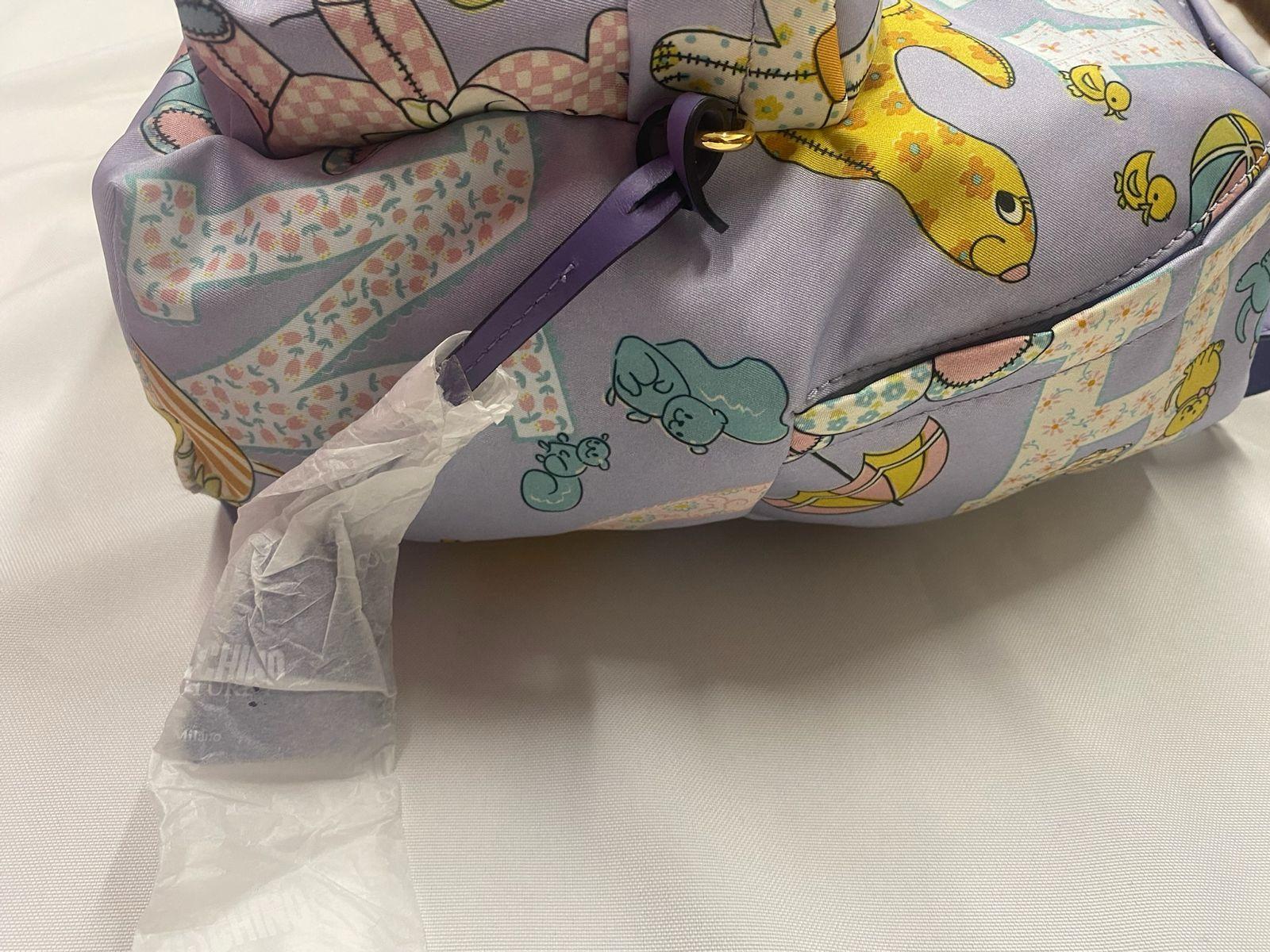 Gray SS22 MOSCHINO Couture Jeremy Scott Kids Fantasy Purple Lion Teddy Bear Backpack For Sale