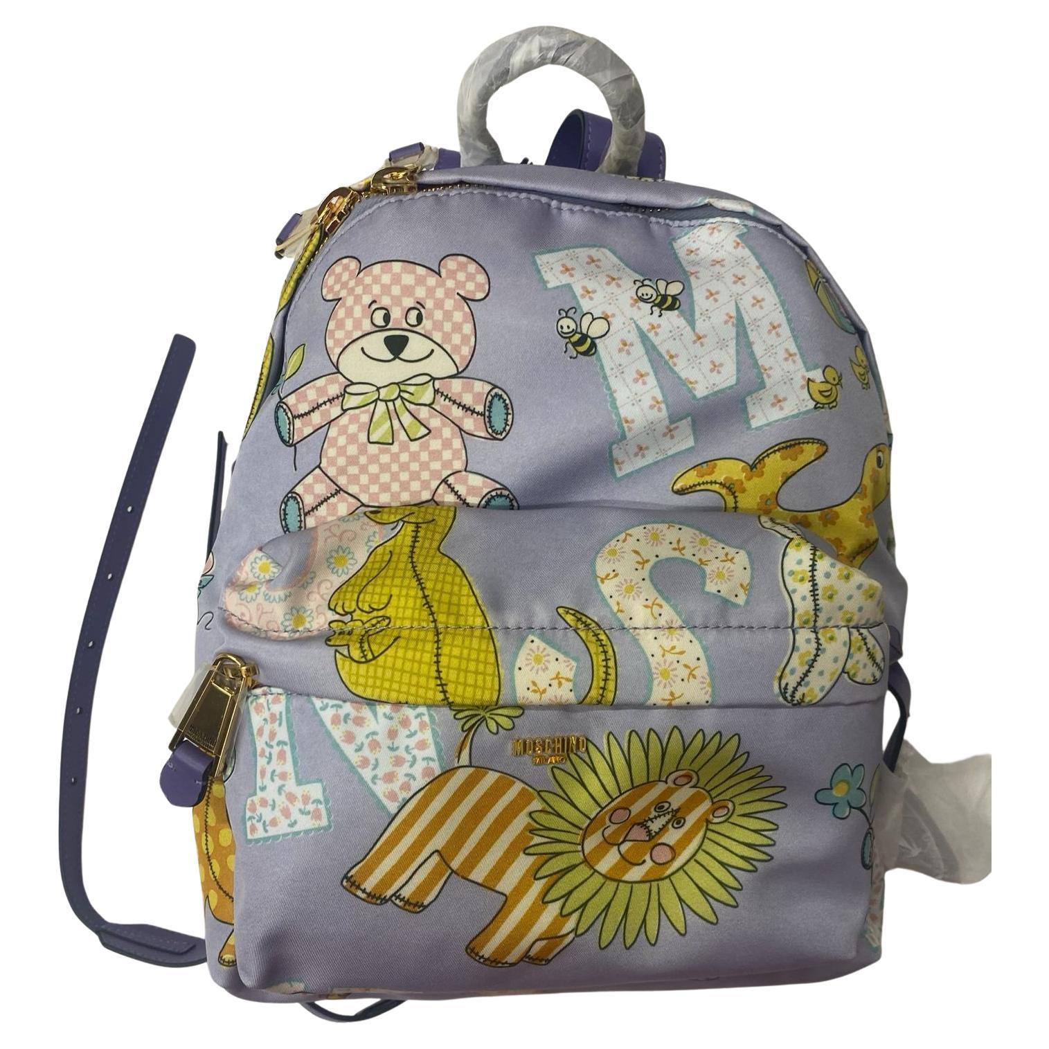 SS22 MOSCHINO Couture Jeremy Scott Kids Fantasy Purple Lion Teddy Bear Backpack For Sale