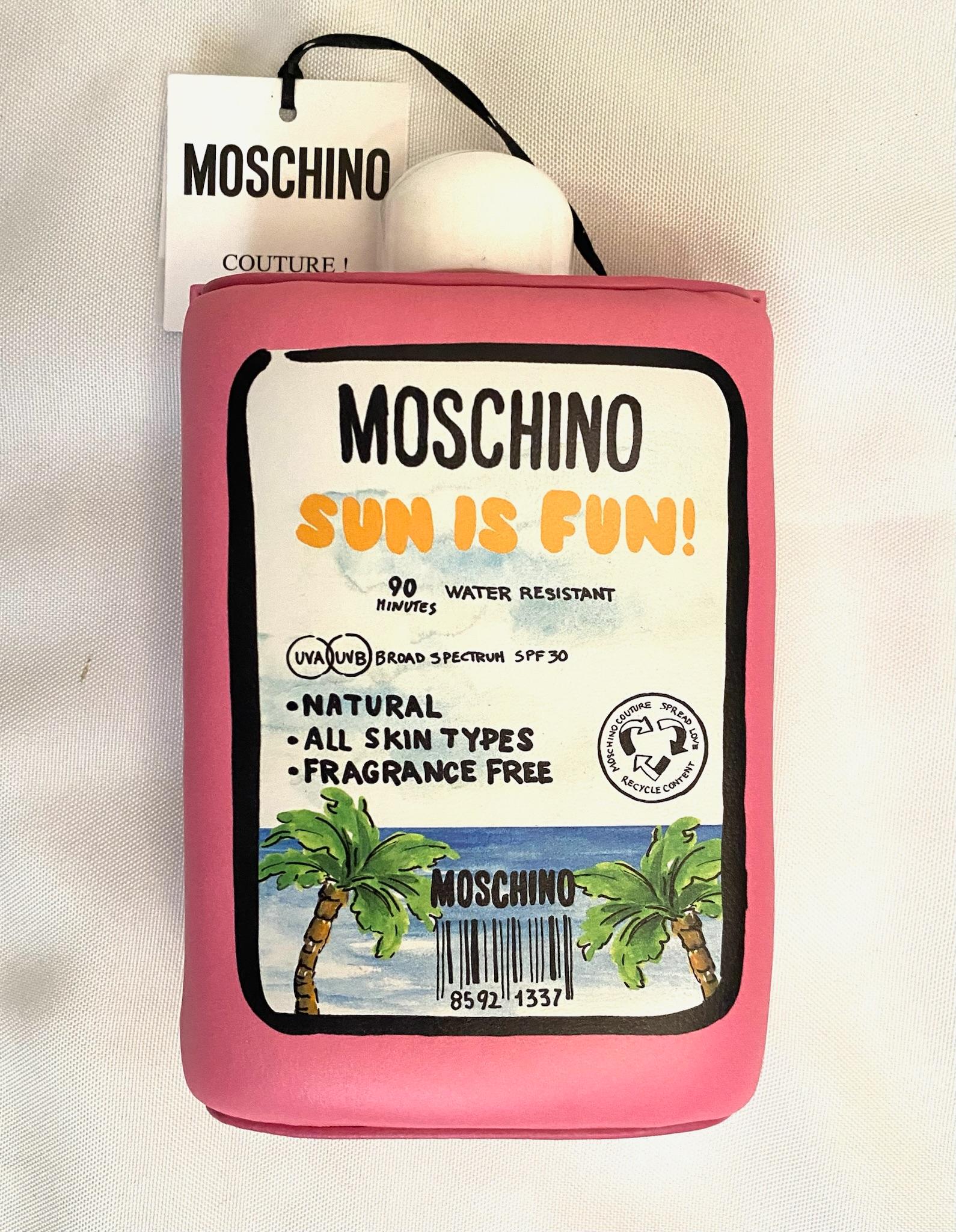 SS22 MOSCHINO Tropical Tan Clutch Pink Padded Nappa Leather Sunscreen 30SPF In New Condition For Sale In Los Angeles, CA