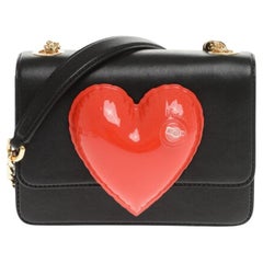 SS23 MOSCHINO Couture Jeremy Scott Bahía de piel negra con corazón rojo hinchable