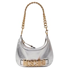 SS23 MOSCHINO Couture Jeremy Scott Silver Top Handle Bag with Gold Logo & Chain
