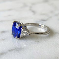 SSEF 10 Carat Cushion Blue Sapphire Platinum Ring with Trillion Diamonds