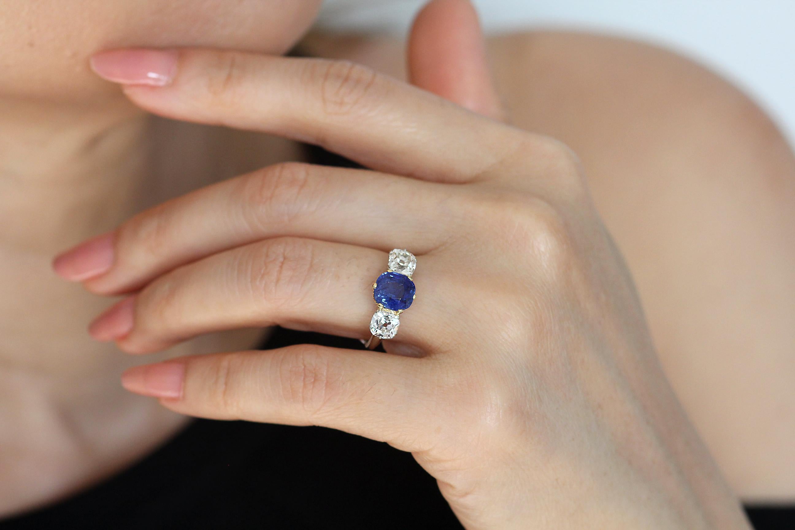 Kashmir Sapphire and Diamond three sone ring in 18 K white and yellow gold.

1 x Antique Cushion Cut Sapphire, Medium Strong Saturation Colour, Weight 2.291 Carats, SSEF Certificate, Natural Sapphire no indication of heating, Origin - Kashmir
There