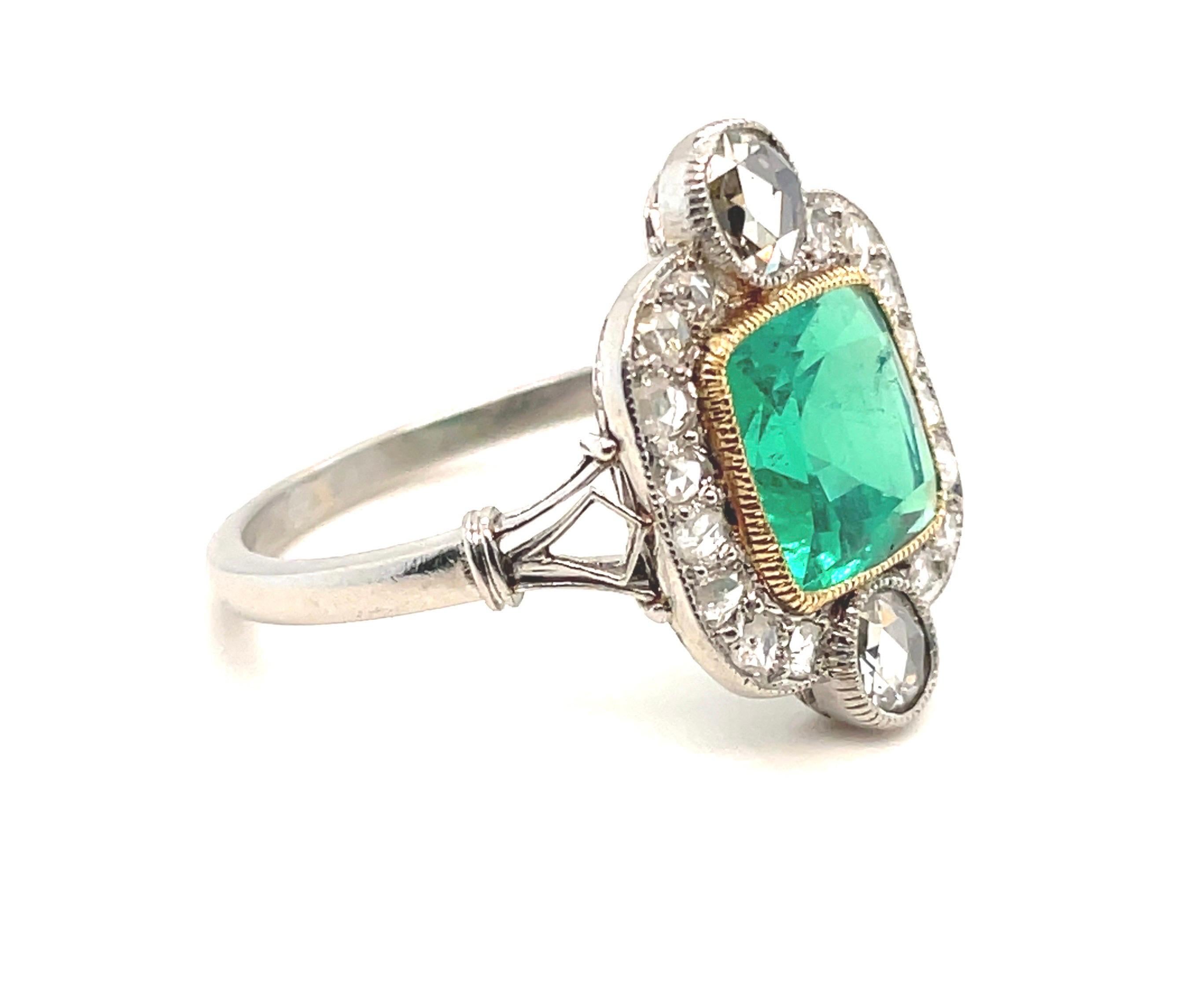Elegant SSEF certified Art-Déco Colombian Emerald and Diamond Ring, dated circa 1920. 

Charming Art-Déco ring, set with a cushion-shaped, luminous Colombian emerald of 2.22 ct, minor enhancement, within a surround of 18 rose-cut diamonds in