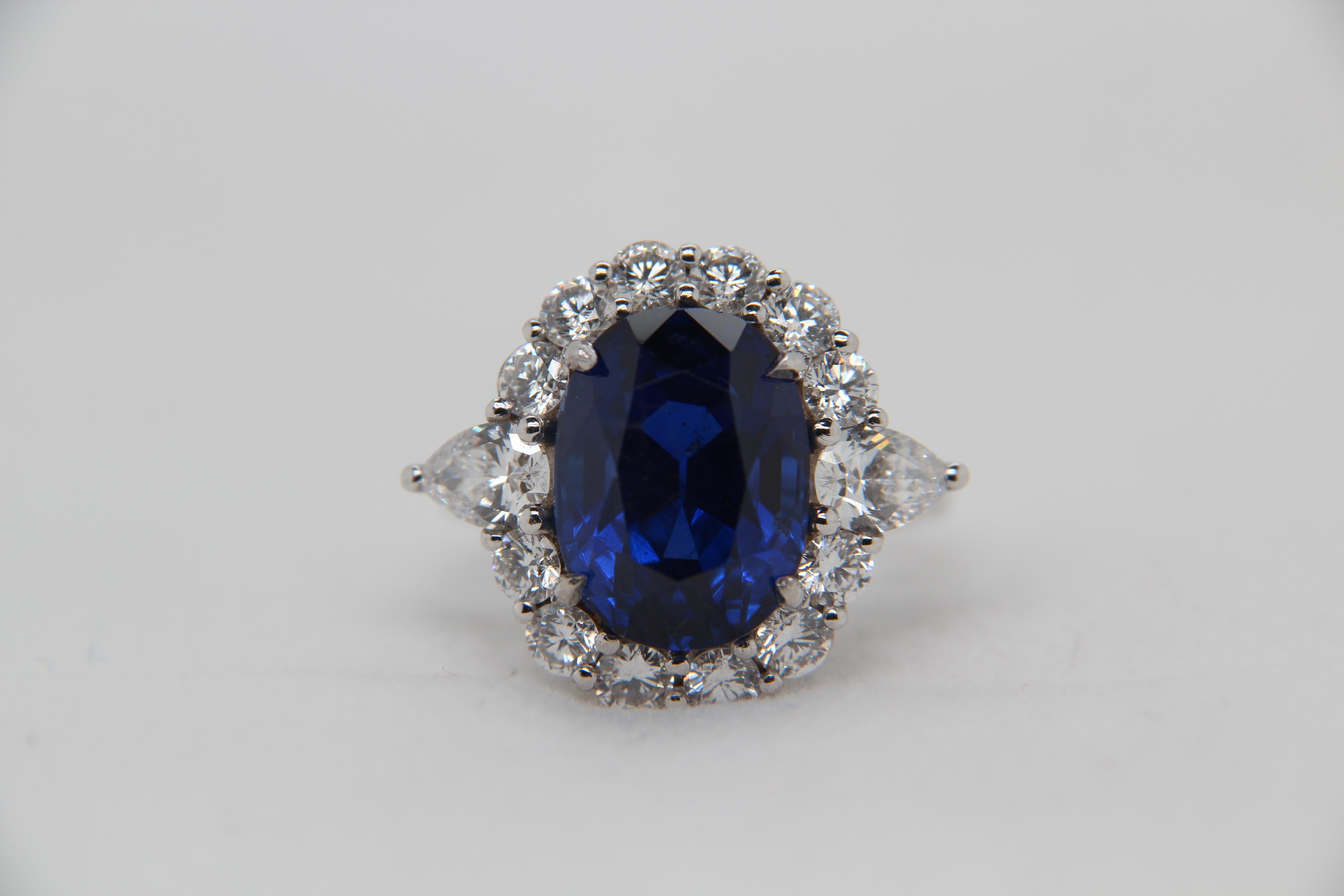 A brand new 9.54 carat blue sapphire and diamond ring made in 18 Karat gold. The total diamond weight is 1.50 carat and the whole weight of the ring is 9.88 grams. The blue sapphire is certified SSEF indicating Burmese no heat with strong saturation.