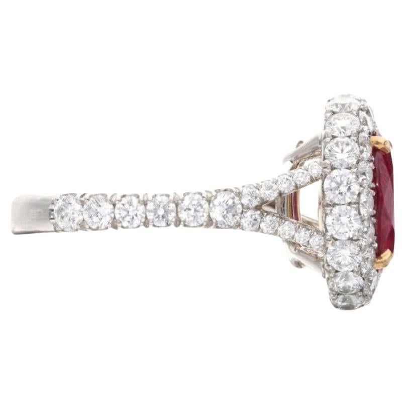 Exquisitely crafted, this magnificent ring showcases an illustrious combination of precious materials and dazzling gemstones. Crafted with meticulous attention to detail, the ring features a striking oval-shaped Burmese ruby as its focal point,
