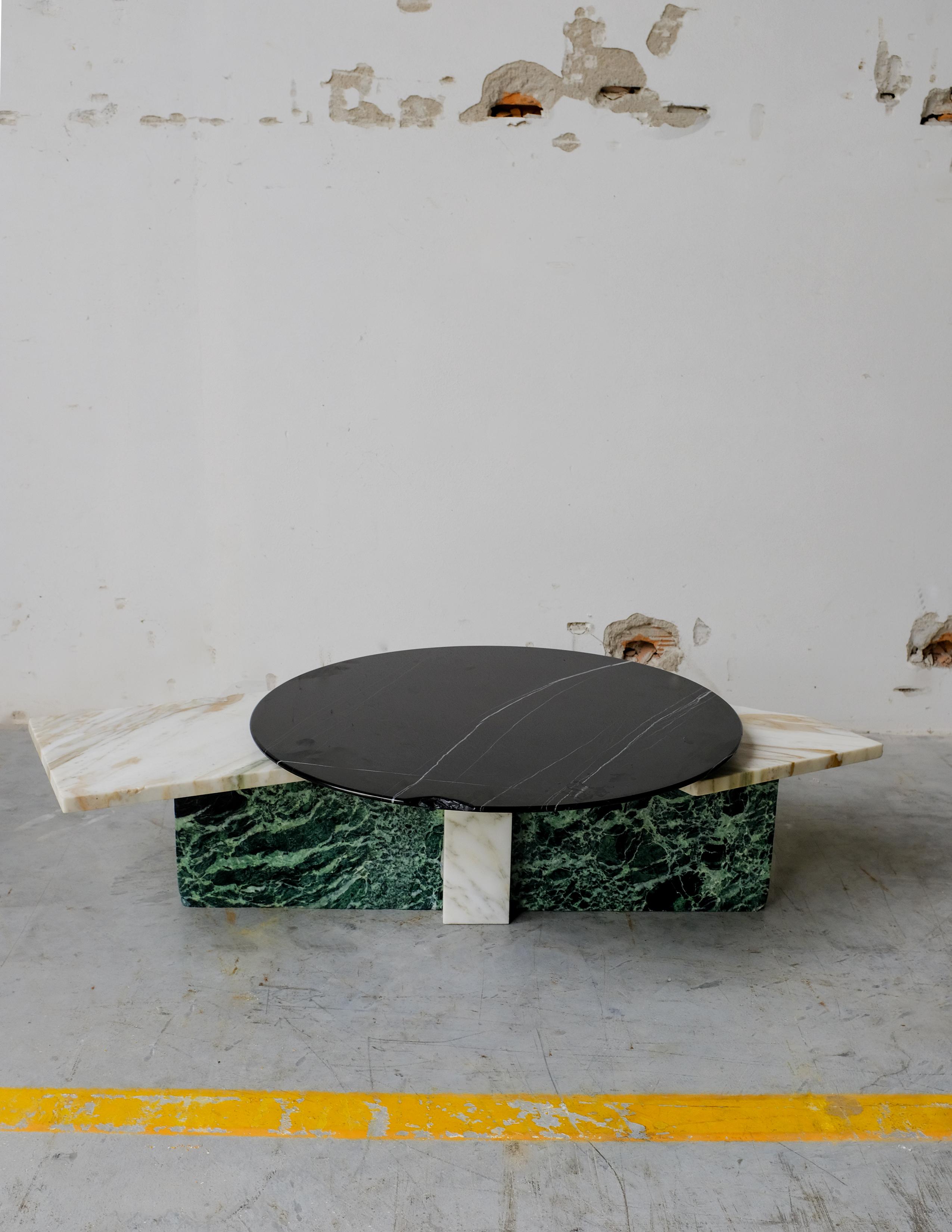 SST003 low table by Stone Stackers
Dimensions: D100x H26 cm
Materials: Marbles:
Marble structure: Verde Alpi
Marble top: Sahara Noir
Marble top lateral: Palissandro
Weight: 49 kg

This particular low table is marked by a subtle beauty