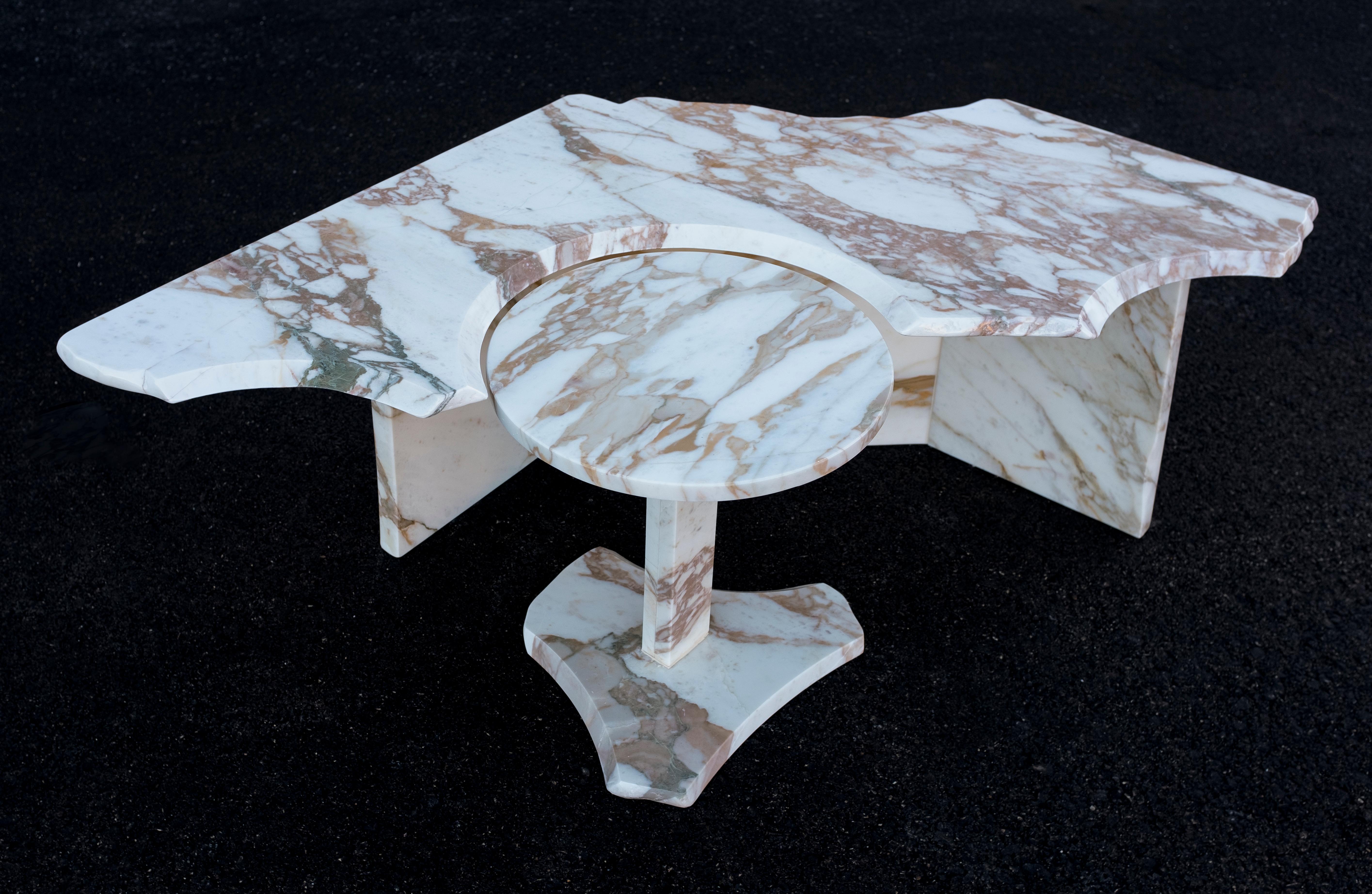 SST015 coffee table by Stone Stackers.
Dimensions: Table 1: W 126 x D 61 x H 39.5 cm.
Table 2: Ø 36 x H 38 cm.
Materials: Calacatta Oro marble.
Weight: 71 kg.

Fashioned by a solid yet intensely sculpted marble top, this table will definitely