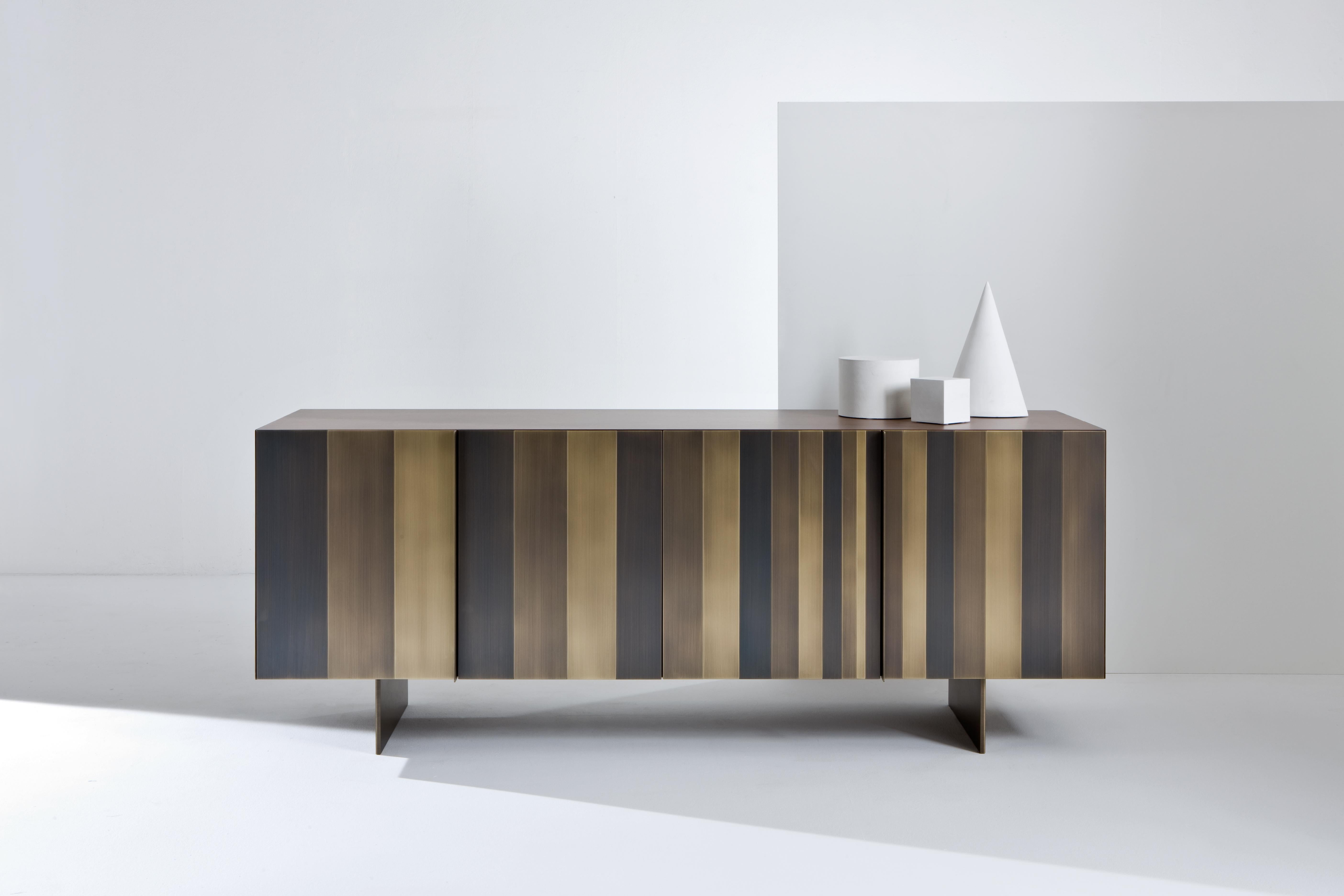 ST 12 Sideboard by Laurameroni
Dimensions: W 198 x D 53 x H 75 cm
Materials: Burnished brass and walnut canaletto dyed.

ST 12 LG OB: Low sideboard with 4 hinged doors and metal legs; equipped with 2 internal drawers. Side panels, doors and legs