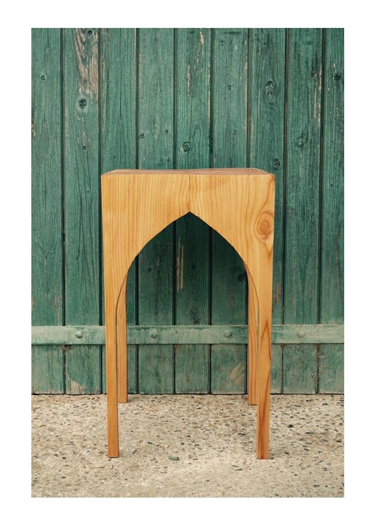Inspired by the architectural beauty of Saint Andre's Cathedral arches in the center of Bordeaux. Made from one single block of douglas pine that has been hand carved and reassembled so as to alter the grain direction. The flowing grain on the top