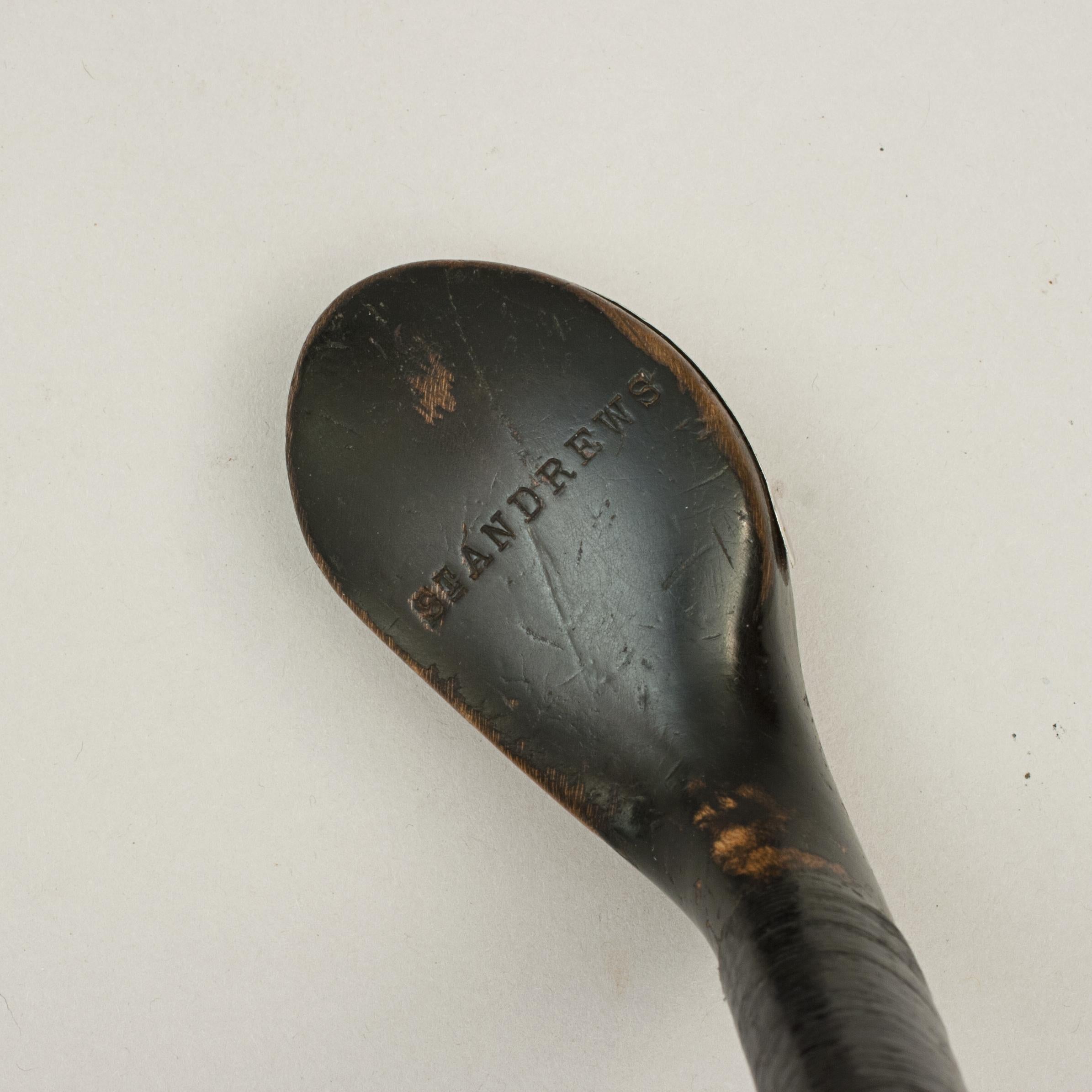 St Andrews golf walking cane, Sunday Club.
A desirable walking cane with the handle in the shape of an early scare headed golf club head. The gentleman's walking stick has a wooden club head with a traditional horn slip along the leading edge of