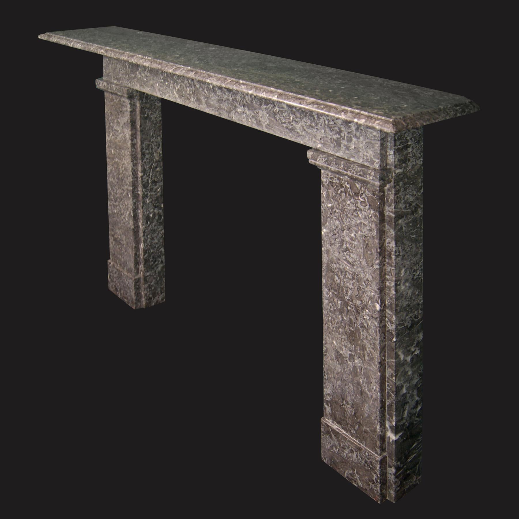 A beautiful St Anne’s marble chimneypiece mantel of late Georgian form, originally from Holderness House, Hull.  The moulded shelf sits on bedding mouldings above a simple frieze.  The stepped jambs with moulded capitals and plinths to meet the