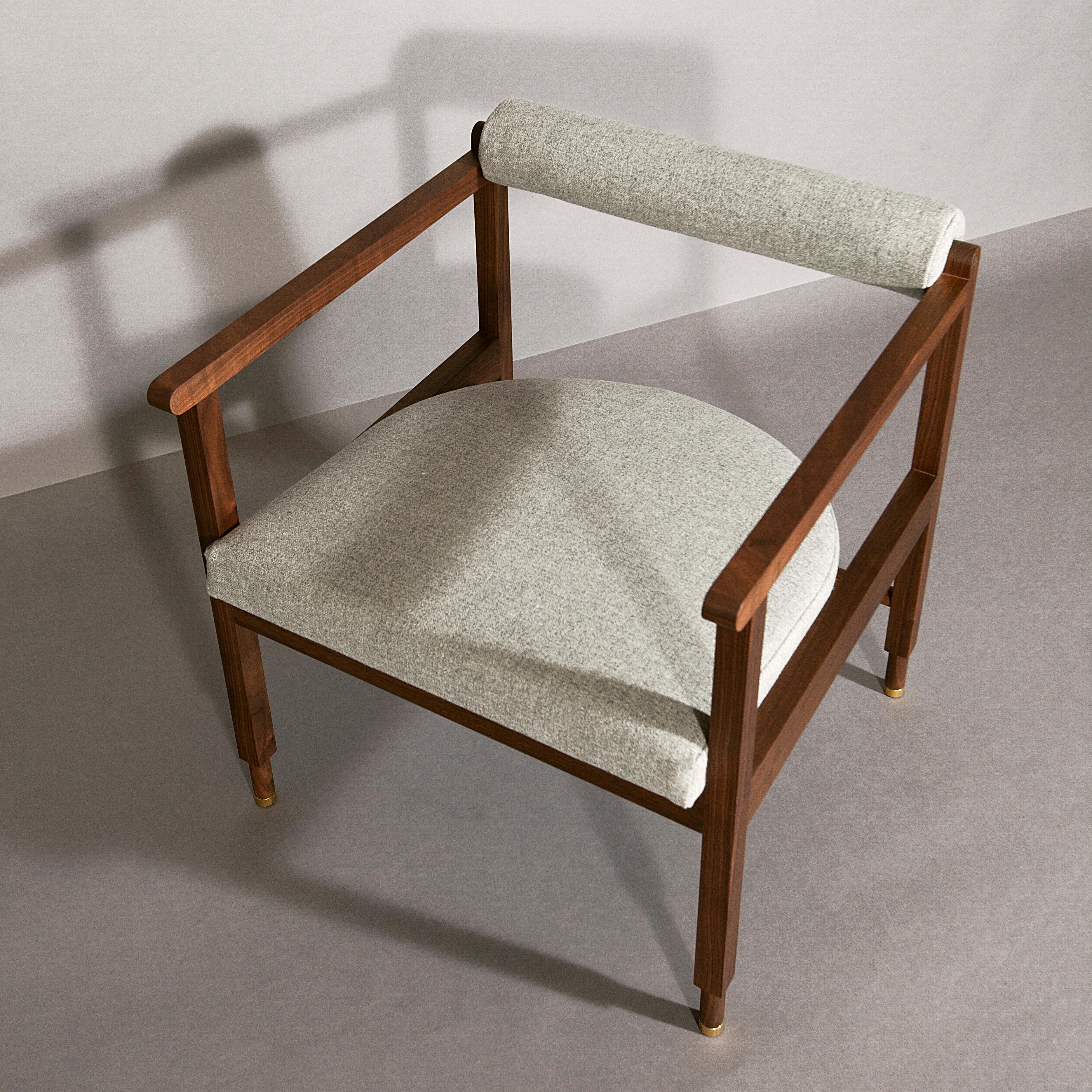 As shown: 
Solid walnut with grey wool upholstery.
Oil and wax finish.
Dimensions: 26 1/2