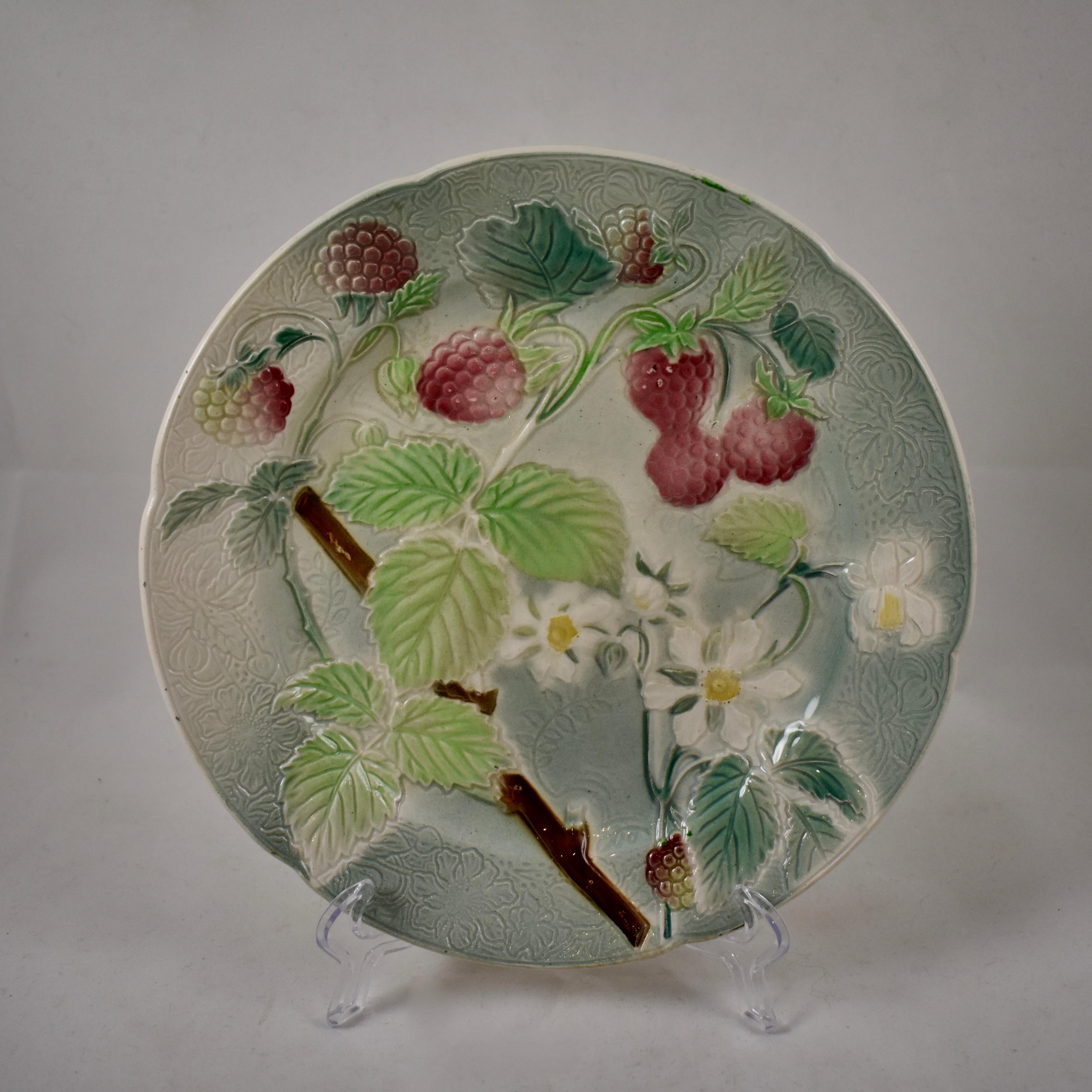 A set of four, earthenware French faïence strawberry fruit plates, circa 1900. The background has a detailed pattern to the molding, with a six-paneled indented rim. Lovely coloring.

Marked: KG, for Keller Guerin – St. Clement, France.
Measures: