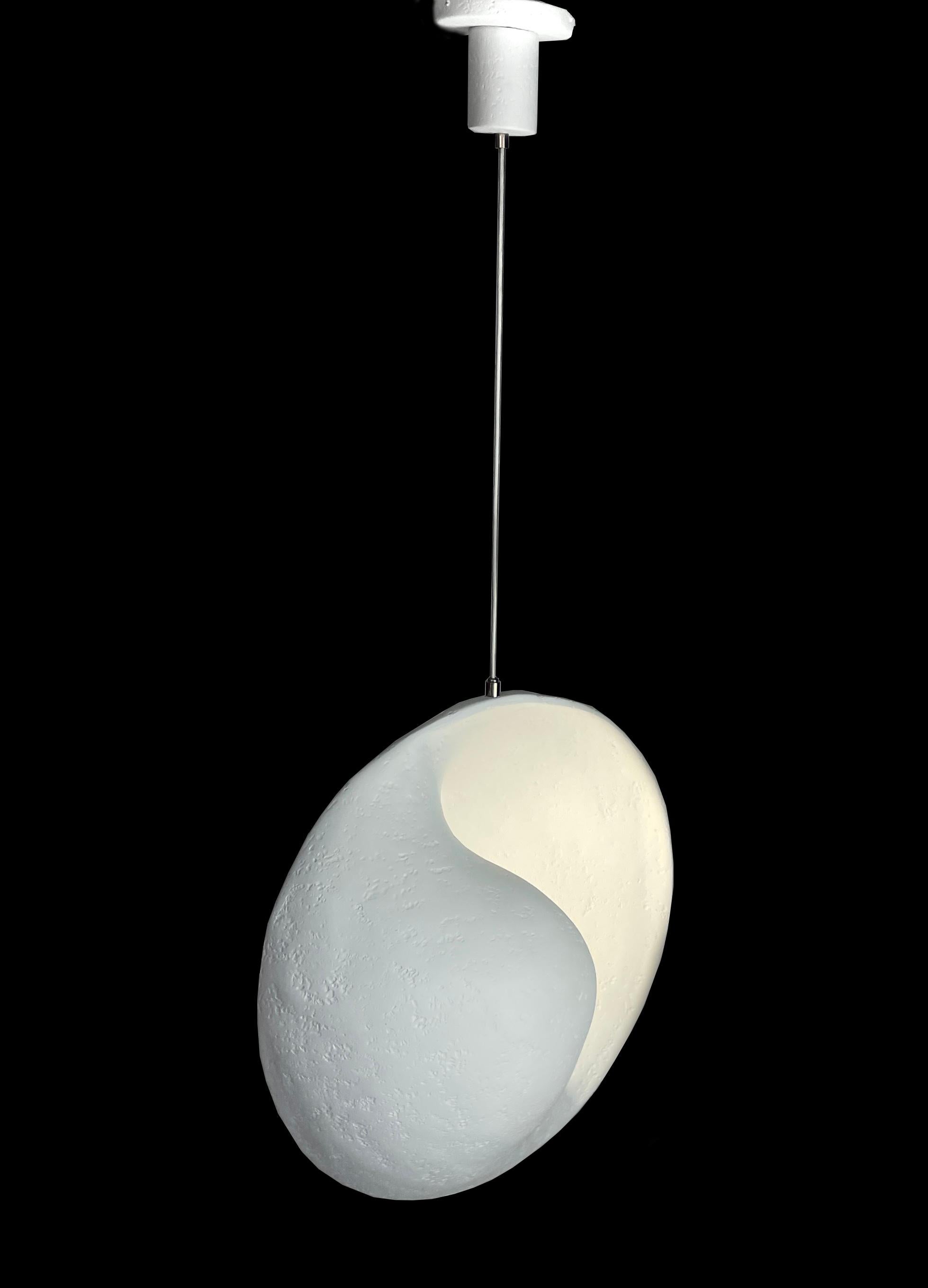 Hand sculpted plaster of Paris chandelier enhancing soft and pure lines. The chandelier features a center circular light diffusing a peaceful glow. Your room will be magically transformed to a restful world.
The dimensions of the plaster piece