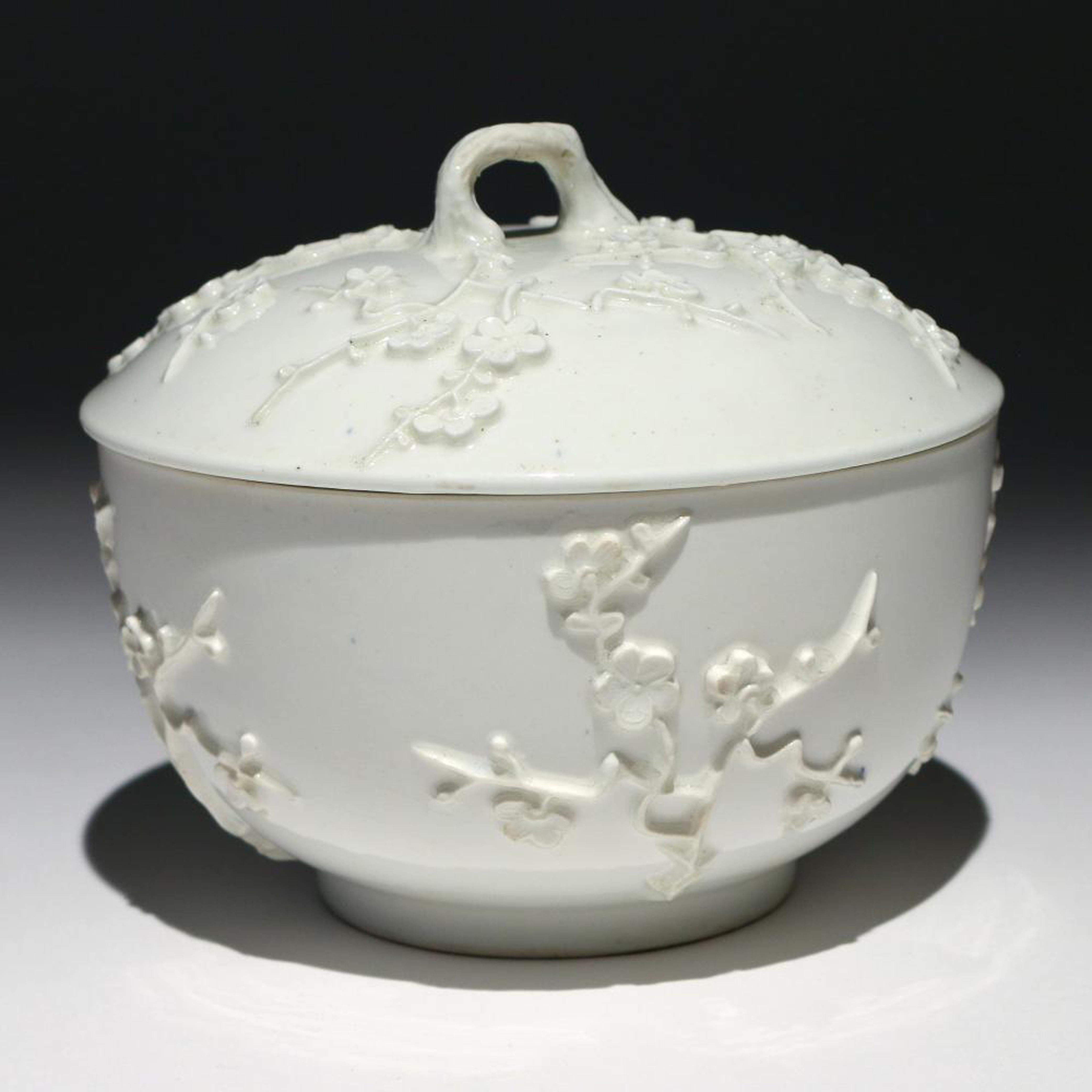 St. Cloud porcelain Prunus covered bowl or tureen and cover, 
French,
circa 1730.
(NY9086)

The circular St. Cloud porcelain covered bowl or tureen is decorated with a prunus decoration in relief after the Chinese.

Dimensions: 5 inches high
