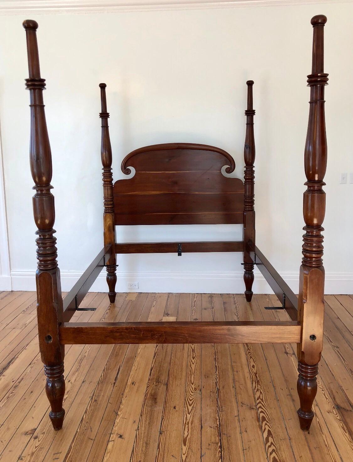 This elegant West Indies poster bed was made in the Caribbean Island of Saint Croix. The Headboard is solid mahogany and carved in the Rams Horn style. The four post are solid mahogany and hand turned. The simplicity of the turnings and classic Rams