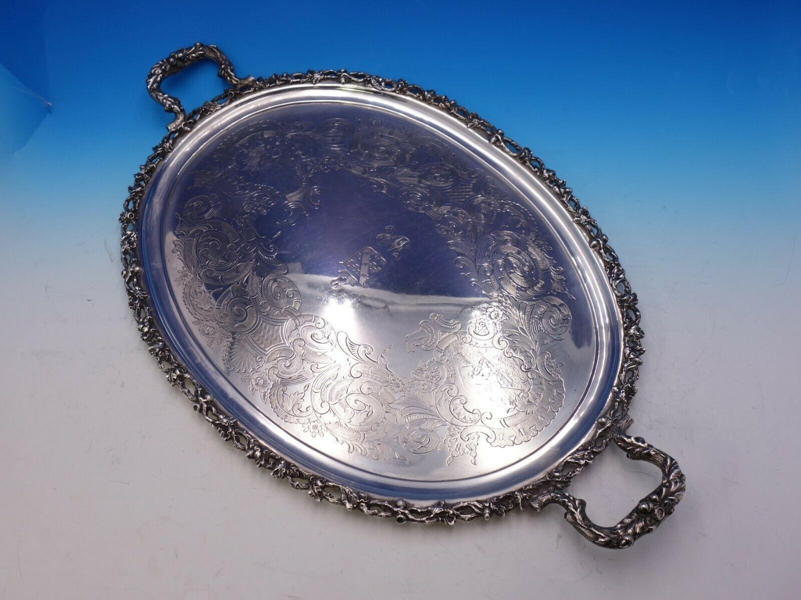 Samuel T. Crosby and Co

Remarkable Samuel T. Crosby and Co of Boston coin silver tea tray dated 1860. The border is cast with pierced branch with oak leaves and acorns. It has an elaborate hand engraved scene with a kneeling man with rifle near