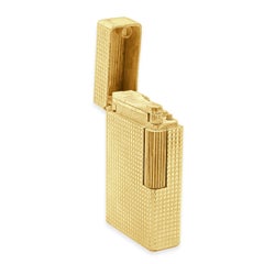 S.T. Accendino Dupont in oro giallo 14 carati con finiture dorate e motivo a chiodini