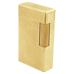 S.T. Accendino Dupont in oro giallo 14 carati con finiture dorate e motivo a chiodini
