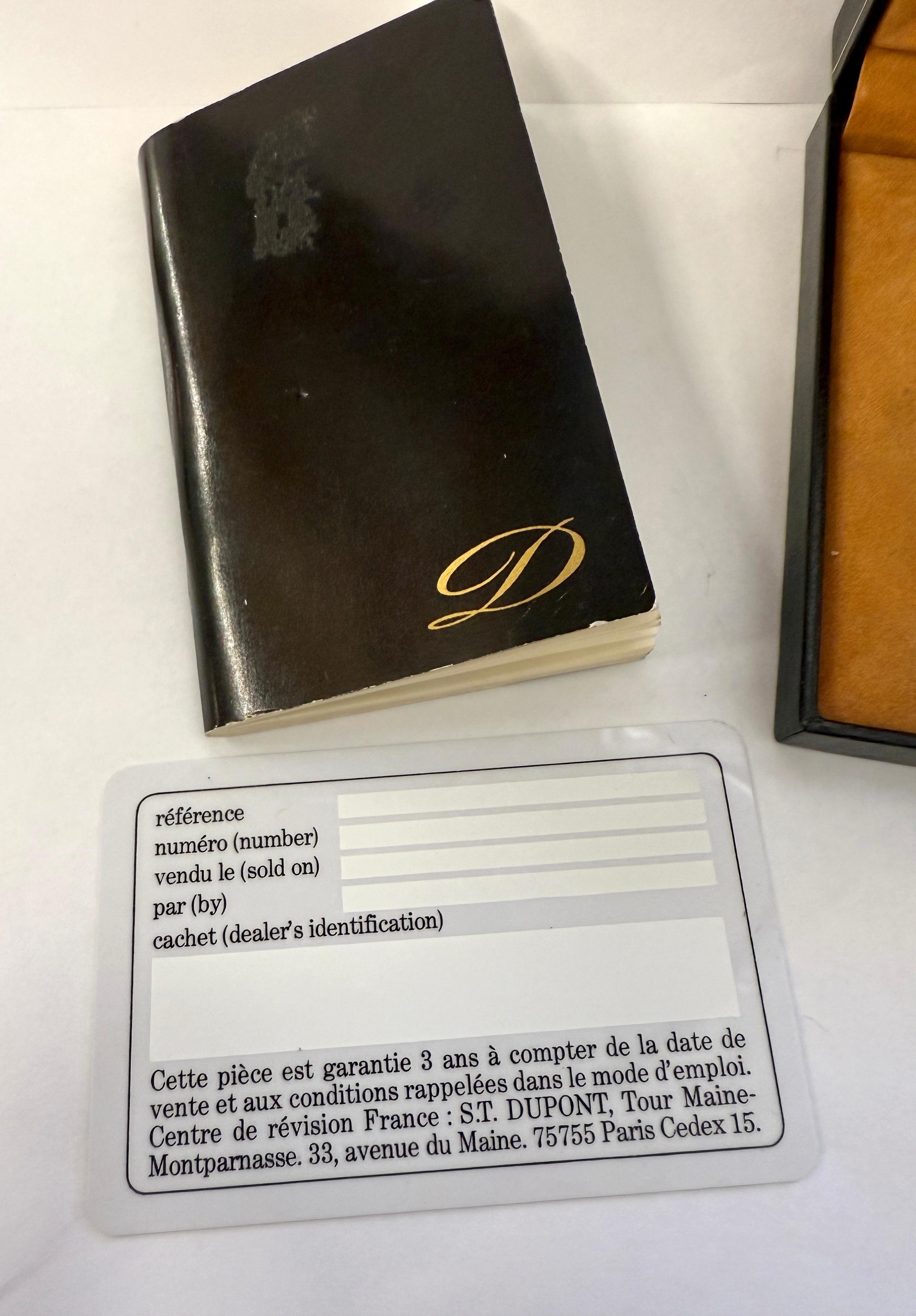 A nice DuPont Butane lighter with a laque de chine and gold plate finish. In good condition with the original box and manual and blank guarantee card. The lighter works. I’ve had a new flint installed. I put some gas in to test it but it will be