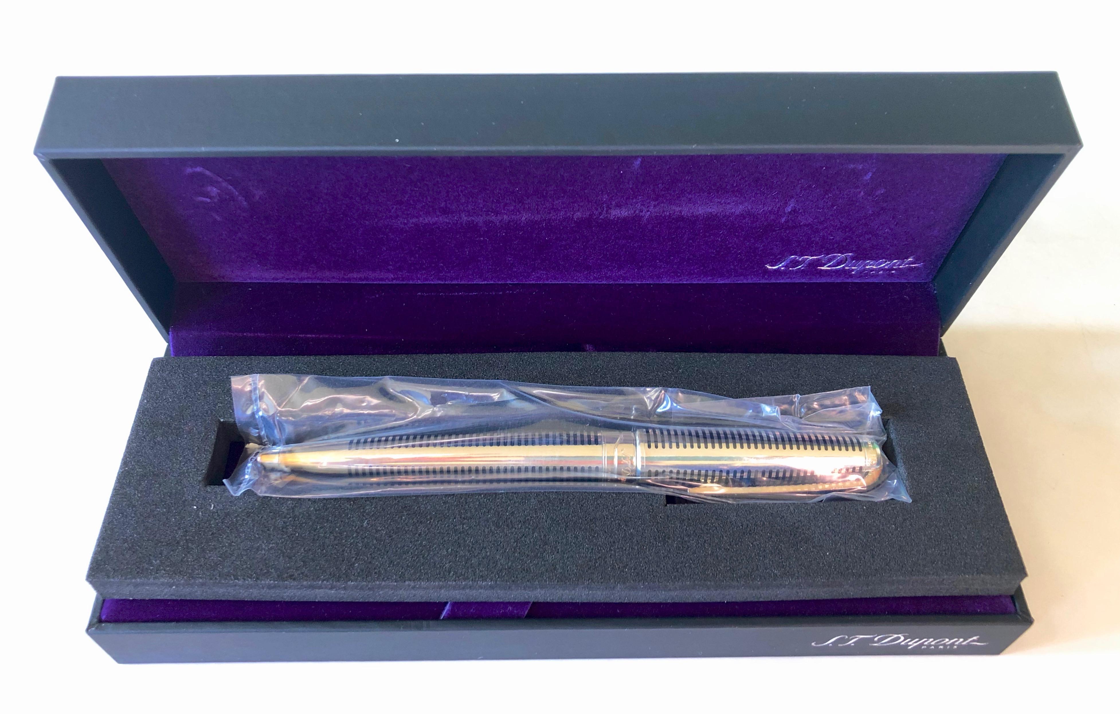This is a French S.T. Dupont Paris Olympio brand new large solid silver ball pen, in it's original case. The pen is still sealed in it's original plastic. It comes with papers and a 2 year worldwide warranty.