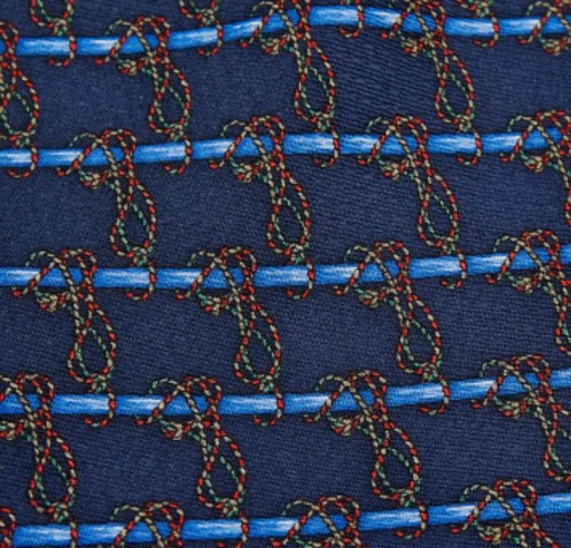 This S.T. Dupont tie is a perfect formal accessory that has a sharp and modern appeal. Made from luxurious materials, it features intricate patterns, and the brand label is neatly stitched at the back. It is sure to add oodles of style to your