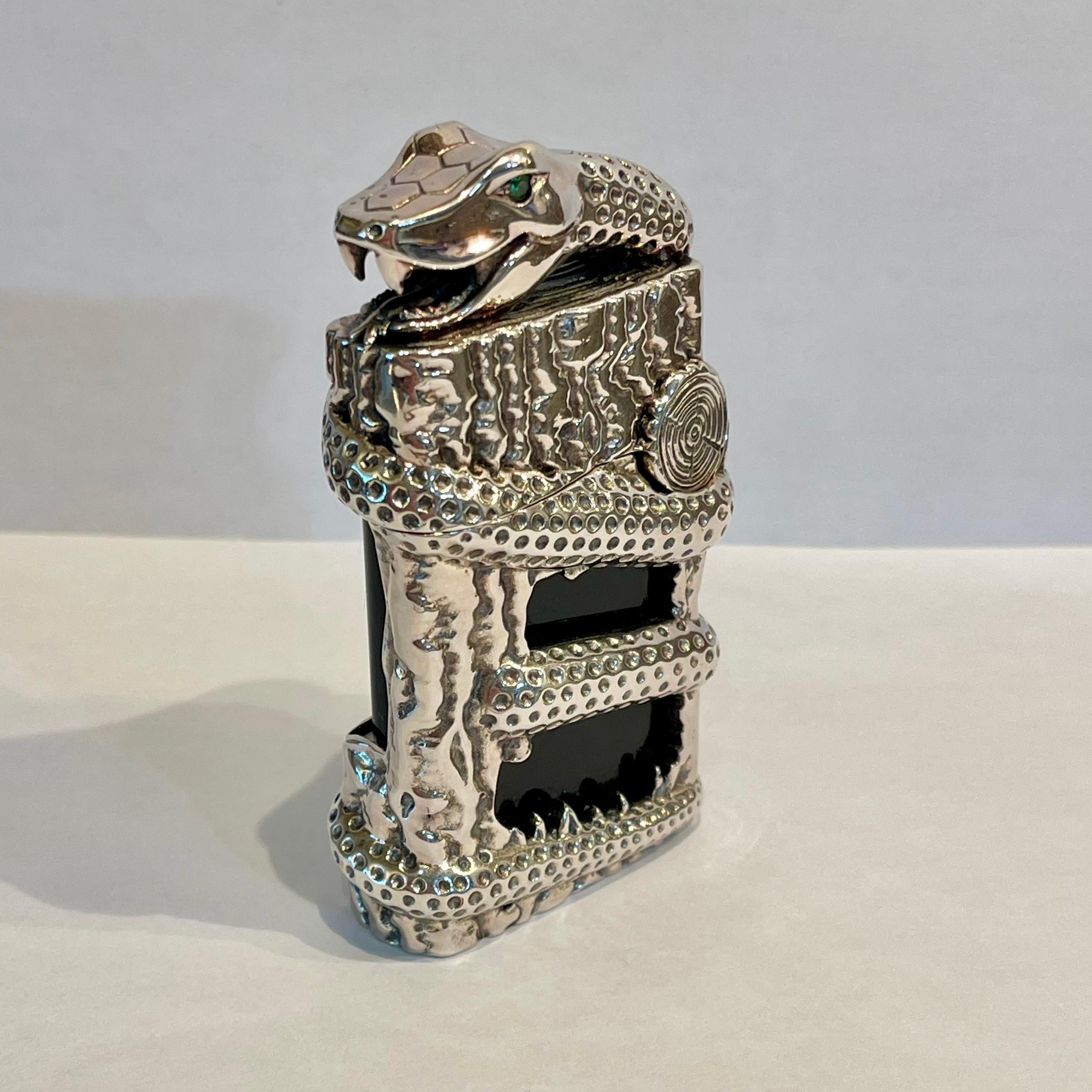 Rare Limited Edition Ligne 2 Snake Lighter.  Designed by Philippe Tournaire master jeweler for Simon Tissot Dupont commemorating the Chinese zodiac year of the snake 2013.  Rendered in a black Chinese lacquer body with a solid brass coiled snack and