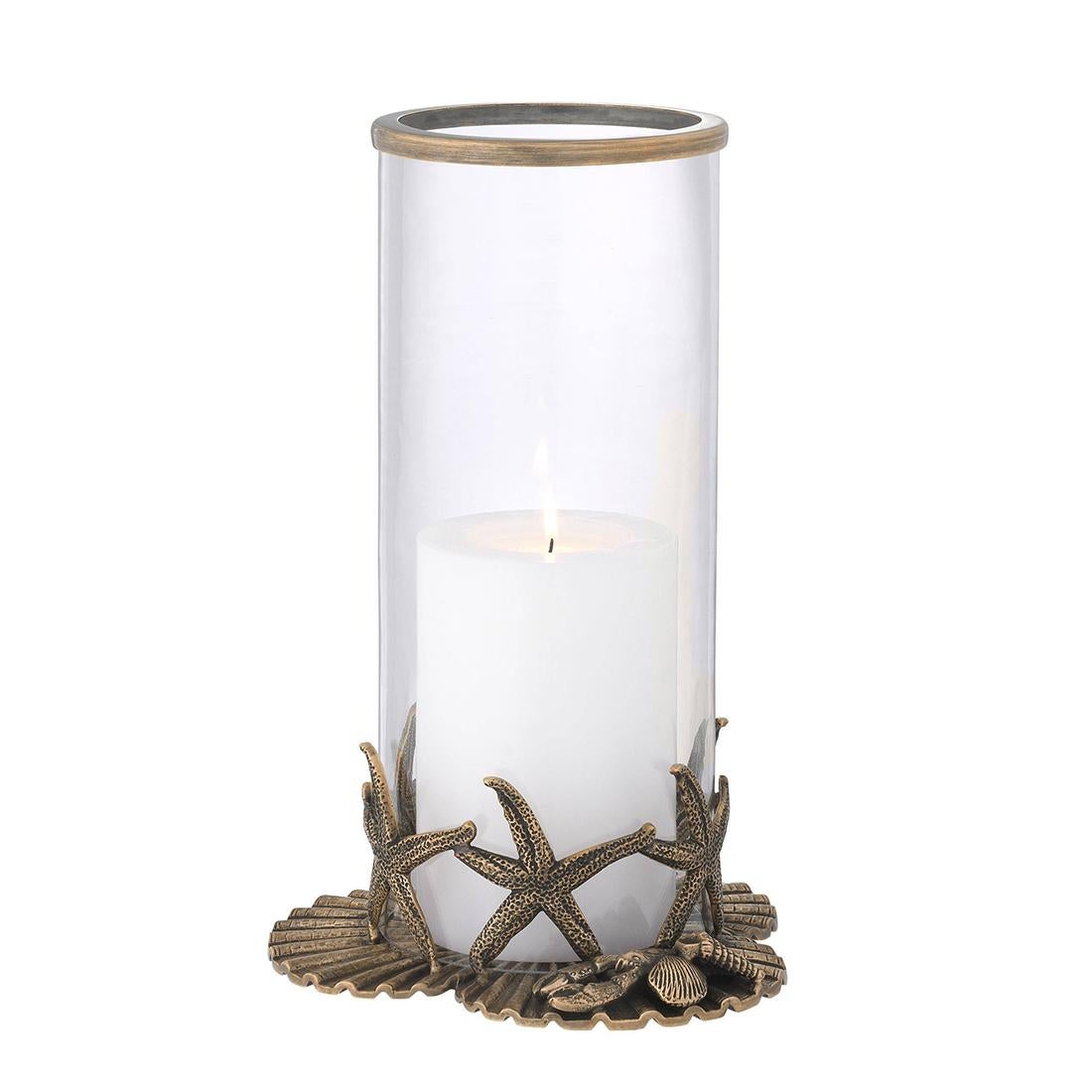 Candle Holder St Jacques Set of 2 with 
solid aged brass base and with clear glass 
photophore. Candle not included.
Base diameter 20,5cm, 
glass candle holder diameter: 13cm.