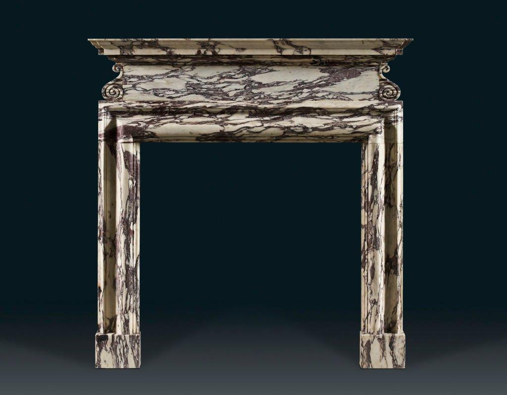 Simple sensuous lines and the rich colors of the Breche Violette marble combine to make this a Classic reproduction English chimneypiece. Based on an early 18th century design by James Gibbs (1682-1754), the bolection frame is surmounted by a frieze