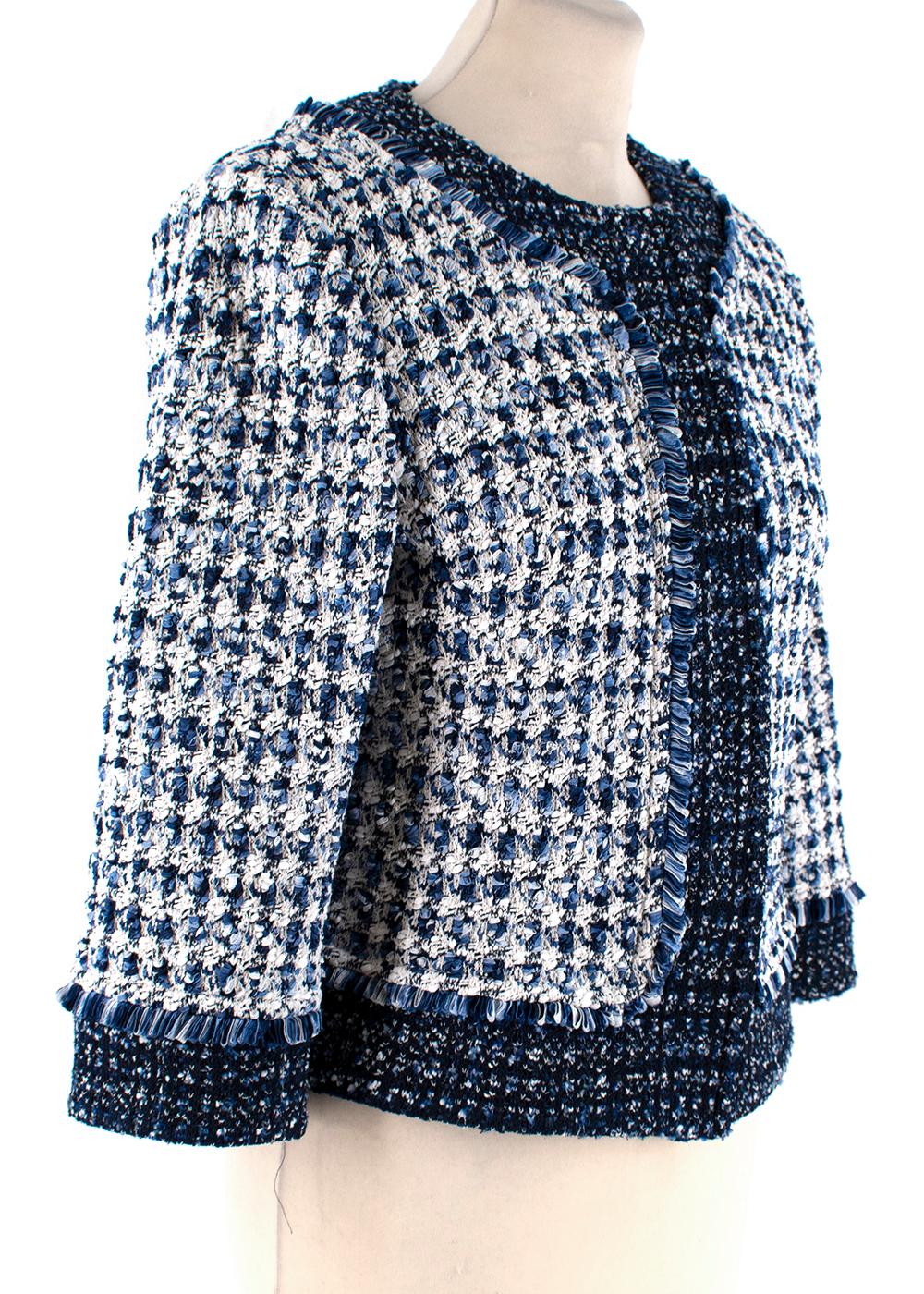 Midnight Blue White Check Tweed Fringe Trim

Done in lovely tweed check knit and trimmed in midnight textured tweed and ribbon fringe, this jacket features round neck, hidden snap closure, 3/4 sleeves, princess seams, and shoulder pads.  

Made in