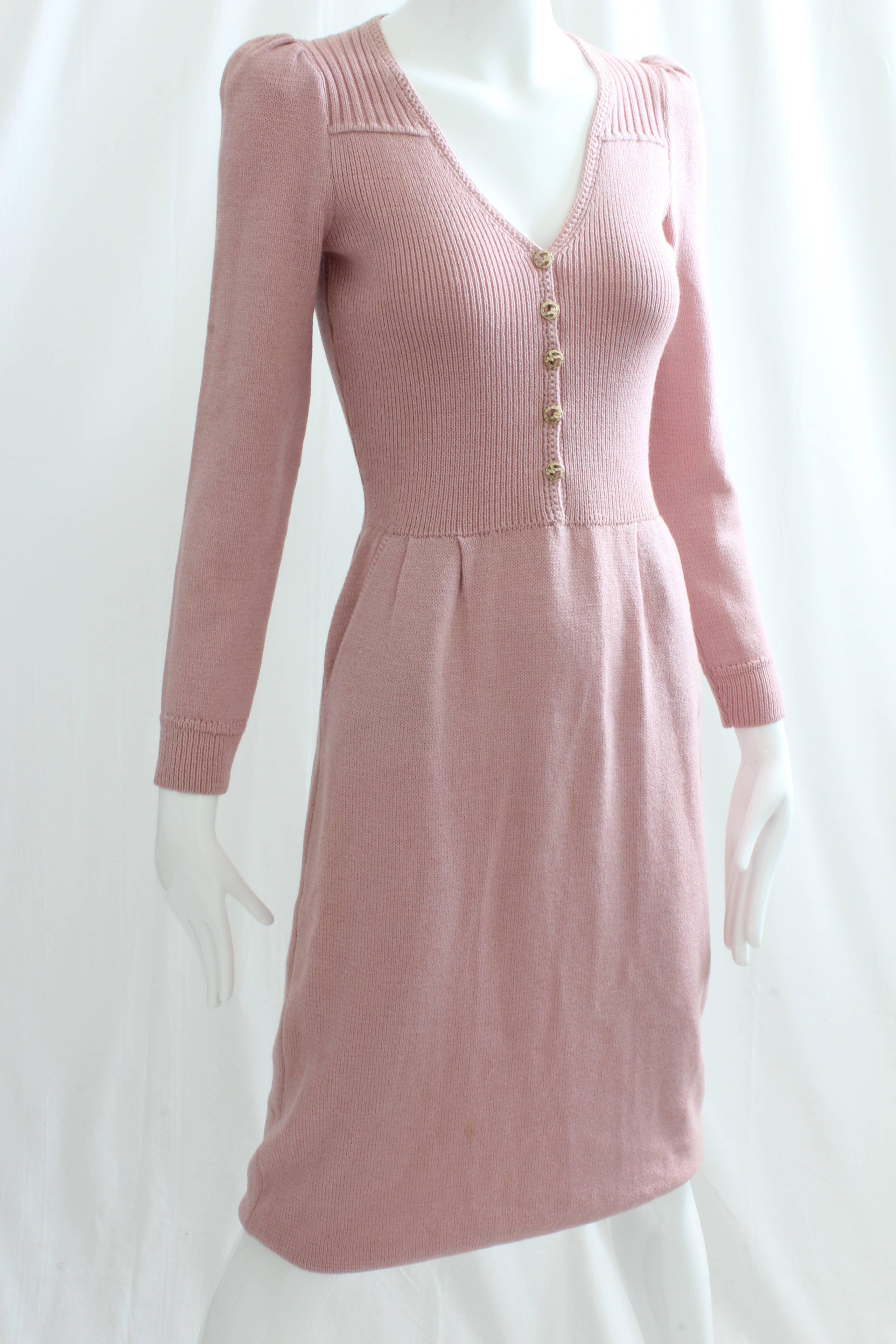 Here's a vintage knit dress from St John by Marie Gray, likely made in the late 70s or early 80s.  Made from a light pink knit, it features a fitted bodice, gold metal SJ buttons at the chest and small shoulder pads.  Unlined, dry clean only.  In