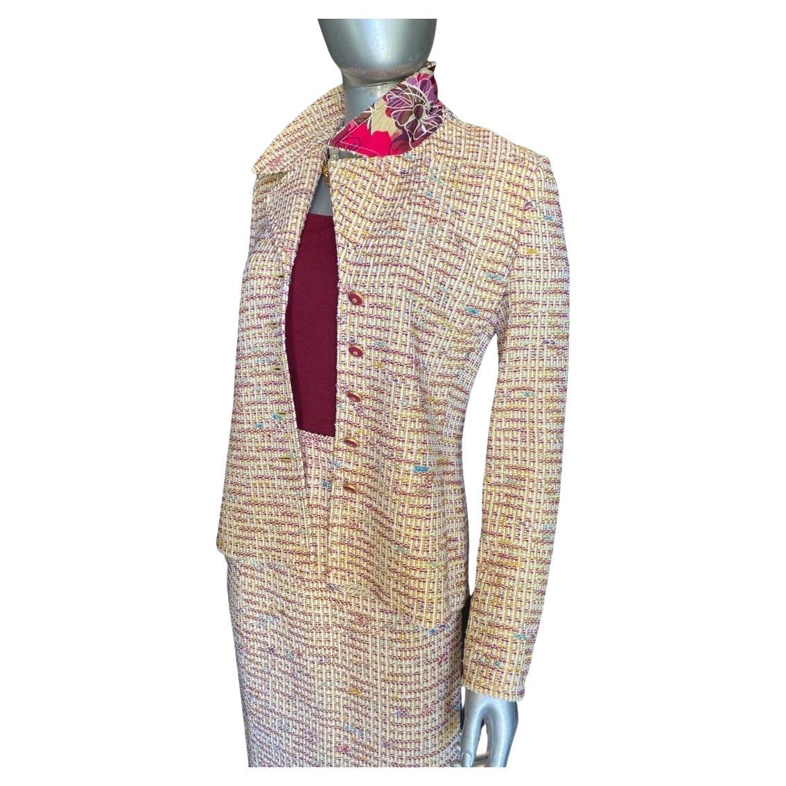 A beautiful suit by St. John Collection. Collection is the high end division, all european fabrics. Think bouclé like the famous french designer suit, but in a modern color knit. Creme, cranberry with a dash of turquoise. All the colors in the knit