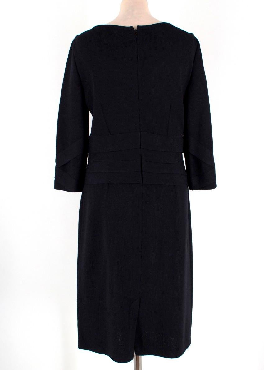 St John Collection Blue Wool Dress

-Blue dress with pleated detailing at the waist
-Knee length 
-3/4 length sleeves
-Tailored around the waist
-Back zip closure

Please note, these items are pre-owned and may show signs of being stored even when