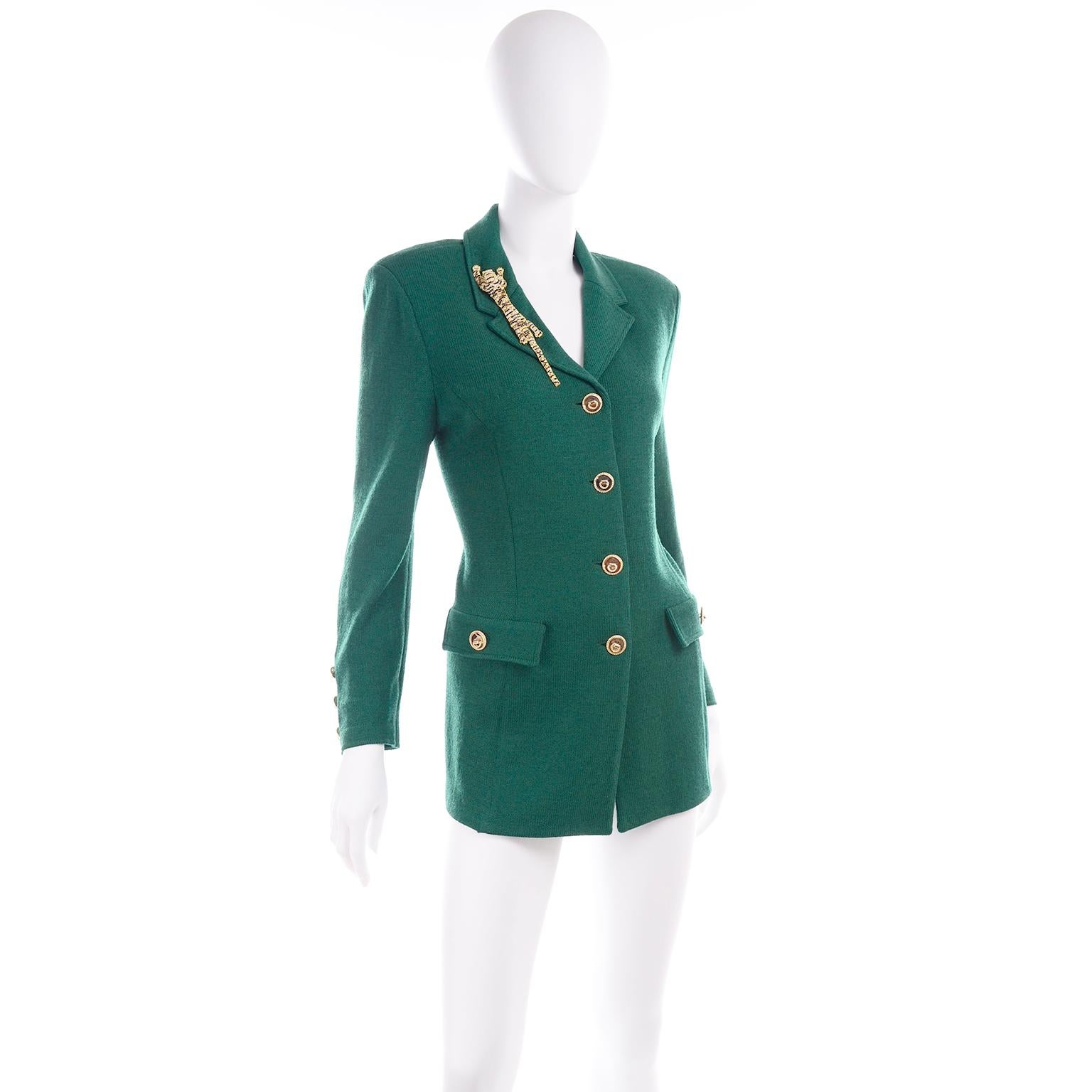 We don't often sell St.John but we fell in love with this rich green Santana knit button front jacket! Mainly, the sewn in oversized dramatic tiger brooch with black and clear rhinestones and green faceted eyes caught our eyes!  There are the St.