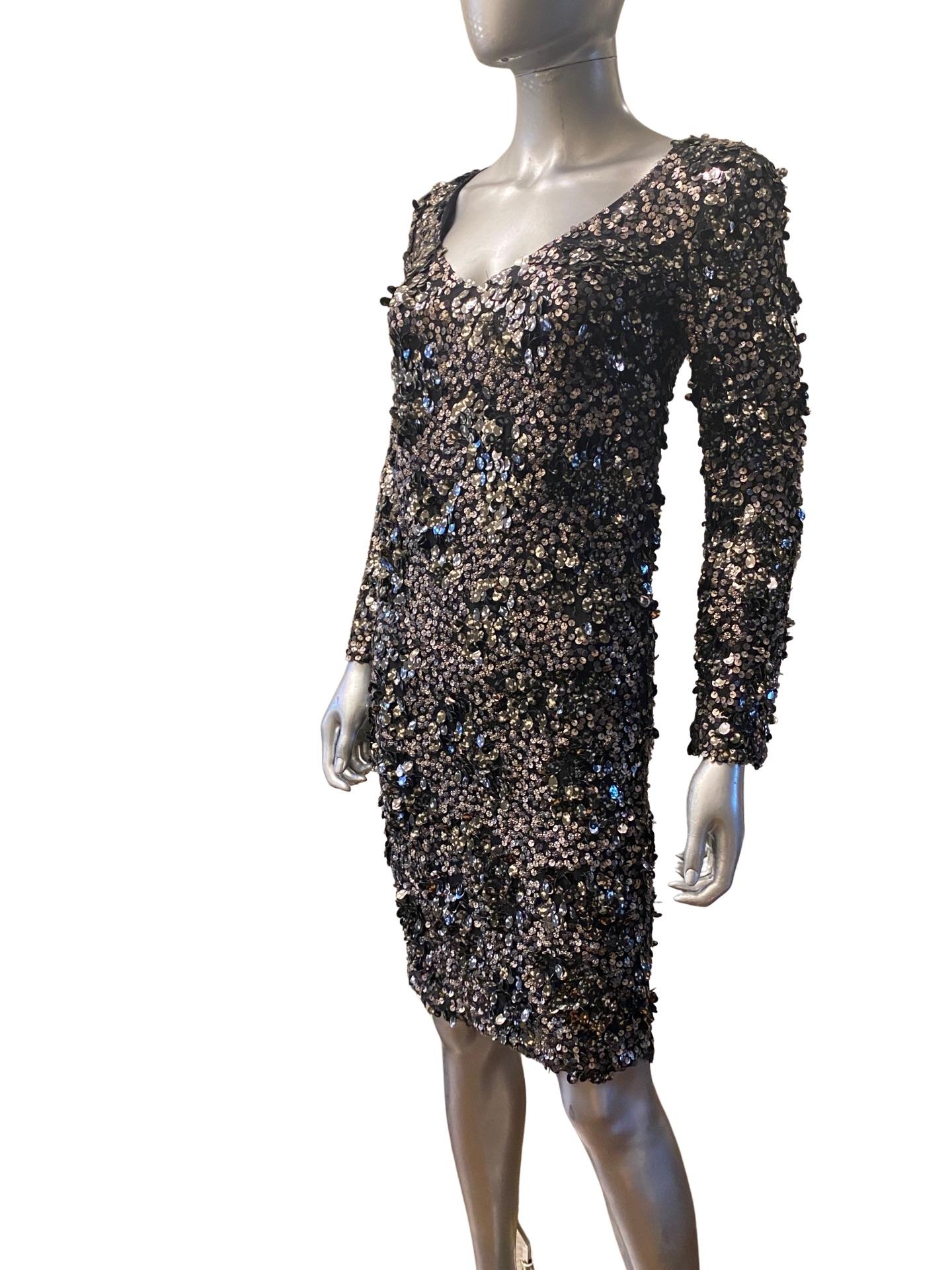 What a showstopper! Modern, slim looking evening dress from St John Couture. Celebrity owned. Worn once. The dress has a v-neck and beautifully cut to accentuate the female figure. What makes the dress spectacular is a combinatin of flat printed