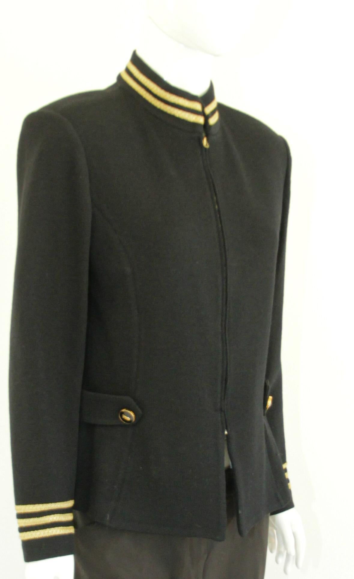 St. John Military Blazer Knit Jacket Navy Blue & Gold Wool Sweater Jacket, 1990's
Fashionable spin on a military look with this wool knit cardigan sweater that resembles a Navy jacket. The decorative gold at the collar, insignia buttons and at the