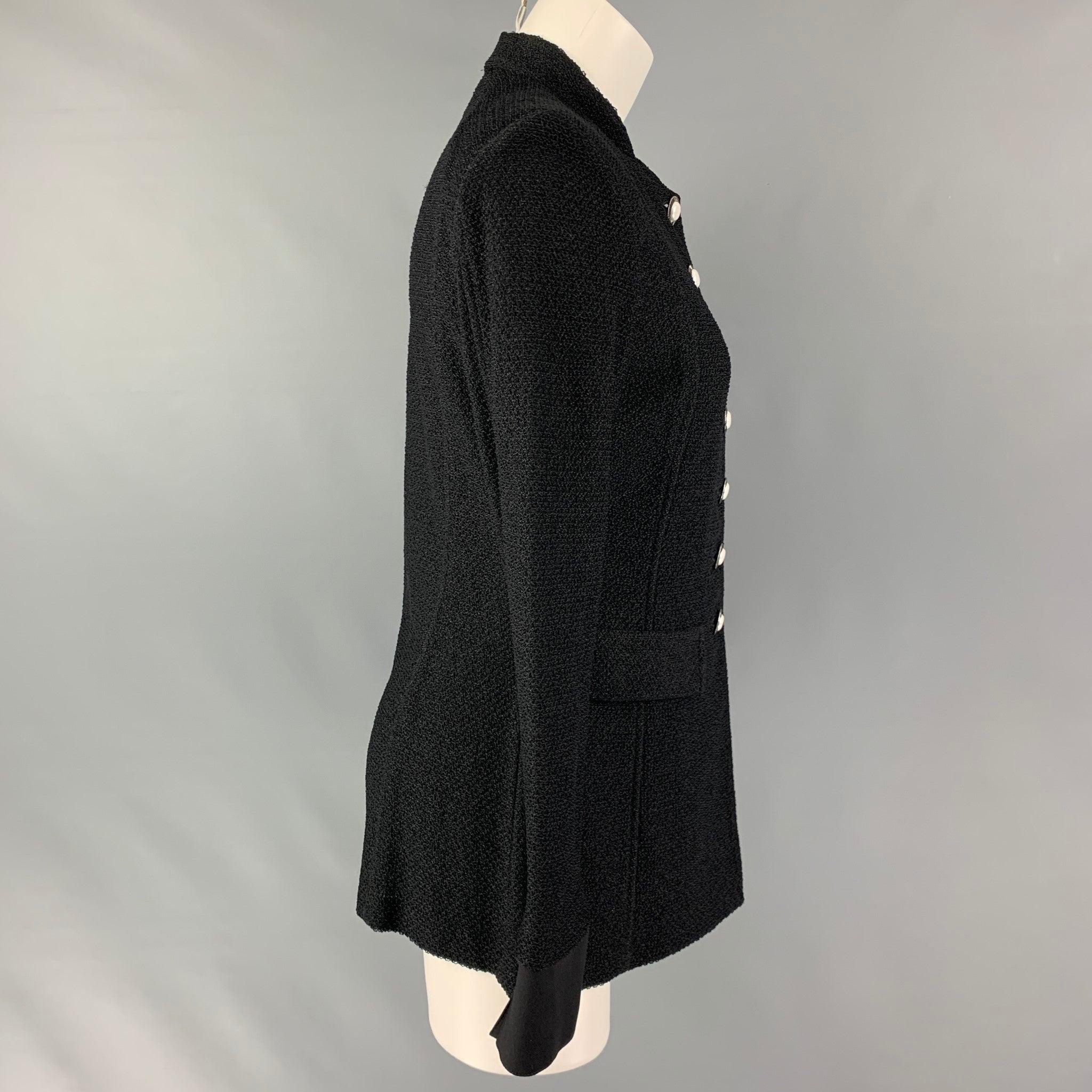 ST. JOHN blazer comes in black wool blend texture fabric featuring, flap pockets, large silver button closure, and shoulder pads. Made in USA.Excellent Pre-Owned Condition. 
 

 Marked:  6 
 

 Measurements: 
  
 Shoulder: 15.5 inches Bust: 38