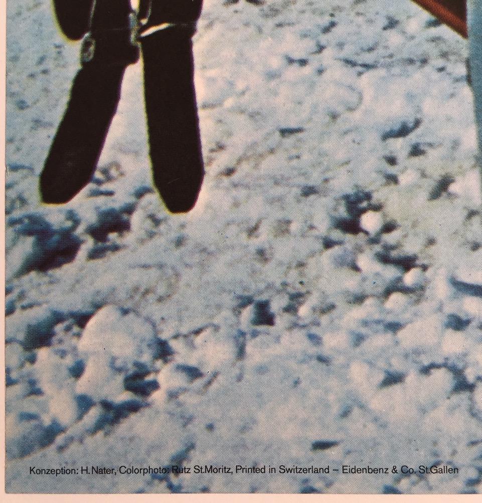 Classic and extremely fun ski poster for St Moritz from 1970. Designed by Hans Nater with photography by Rutz and featuring a skier next to a signpost showing the nearby ski runs in the Engadin part of Switzerland.

Linen-backed in excellent