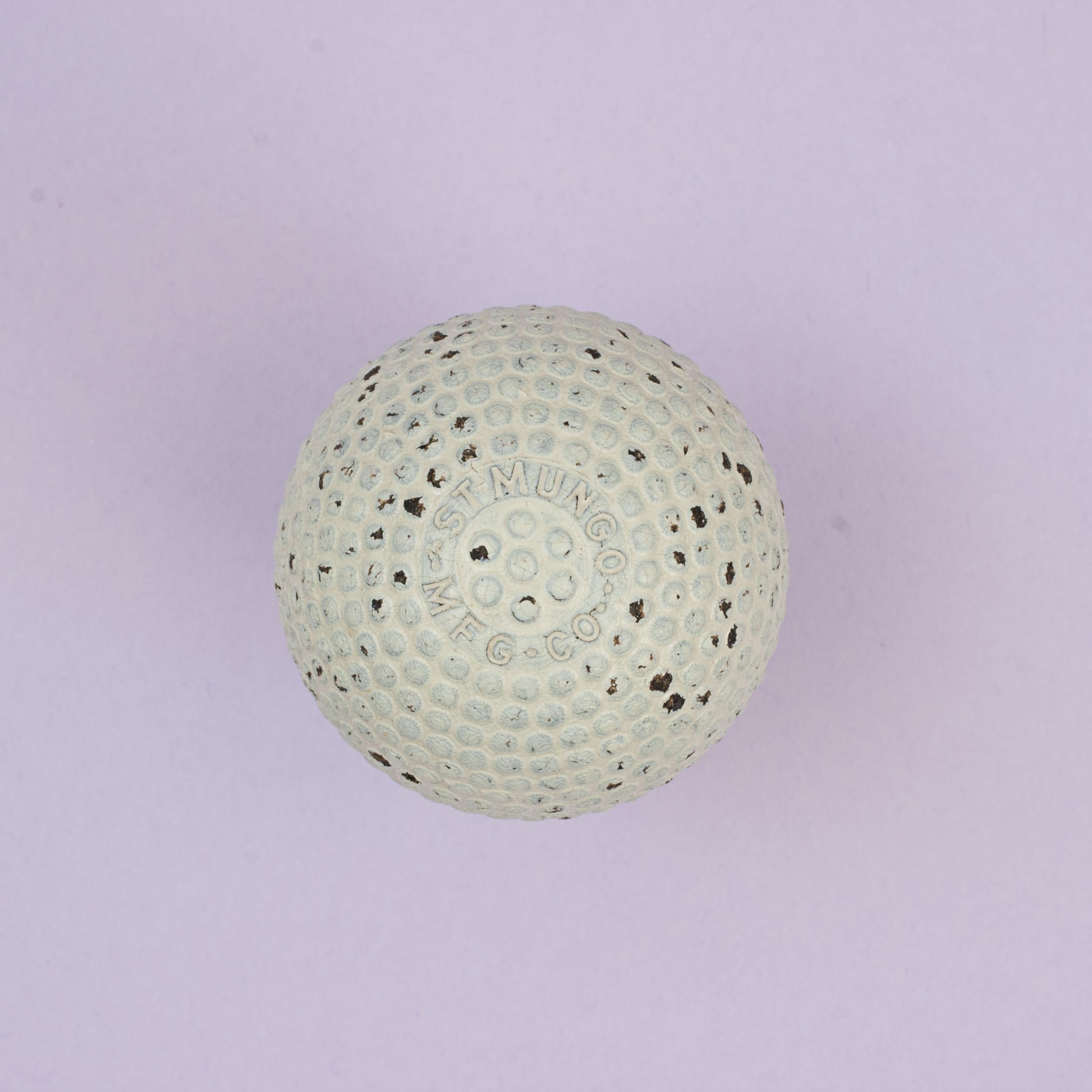 St. Mungo Bramble Golf Ball.
A very nice bramble pattern golf ball with original paint which remains bright and with minimal paint loss. The gutta percha covered, rubber core, golf ball is marked 'St. Mungo, MFG. Co.' on a raised circle, with seven