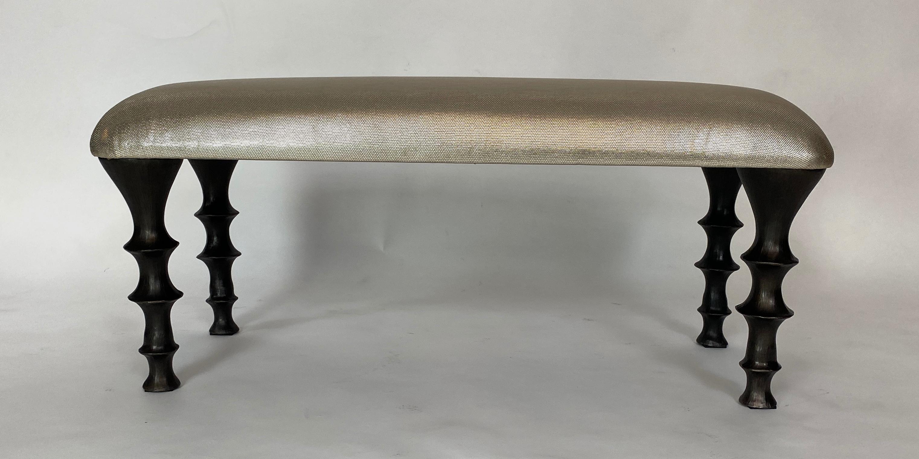 Versatile bench with cast silicon bronze legs with an embossed metallic cowhide cushion. The design of the legs have an organic texture. This bench will make a powerful statement in your
interior. Bench can also be made custom in different size and