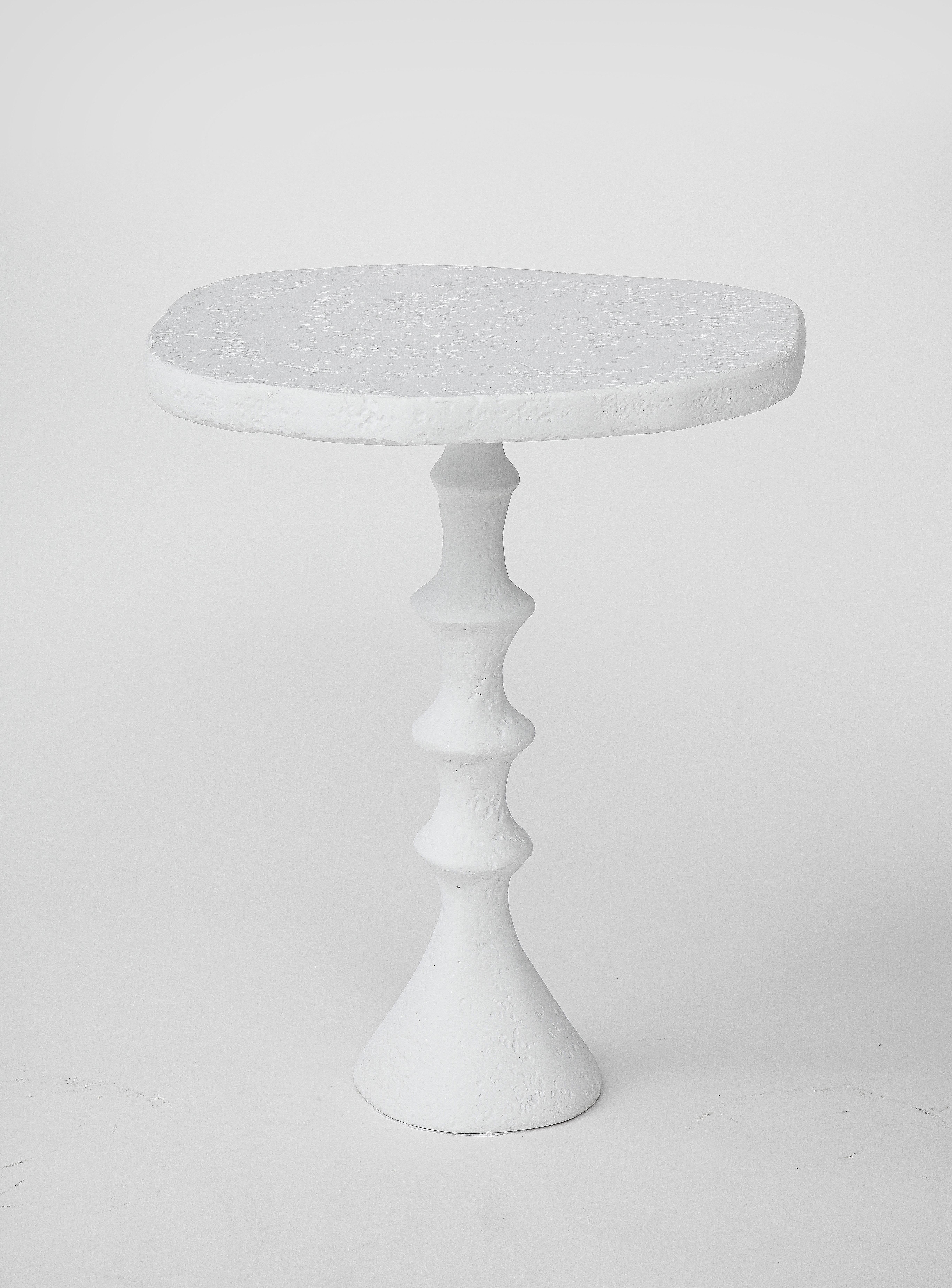 This side table is part of our St. Paul collection. Hand crafted plaster of Paris finish with an organic design. This small scale pedestal side table has our signature plaster of Paris finish which we use on our furniture and lighting collection.