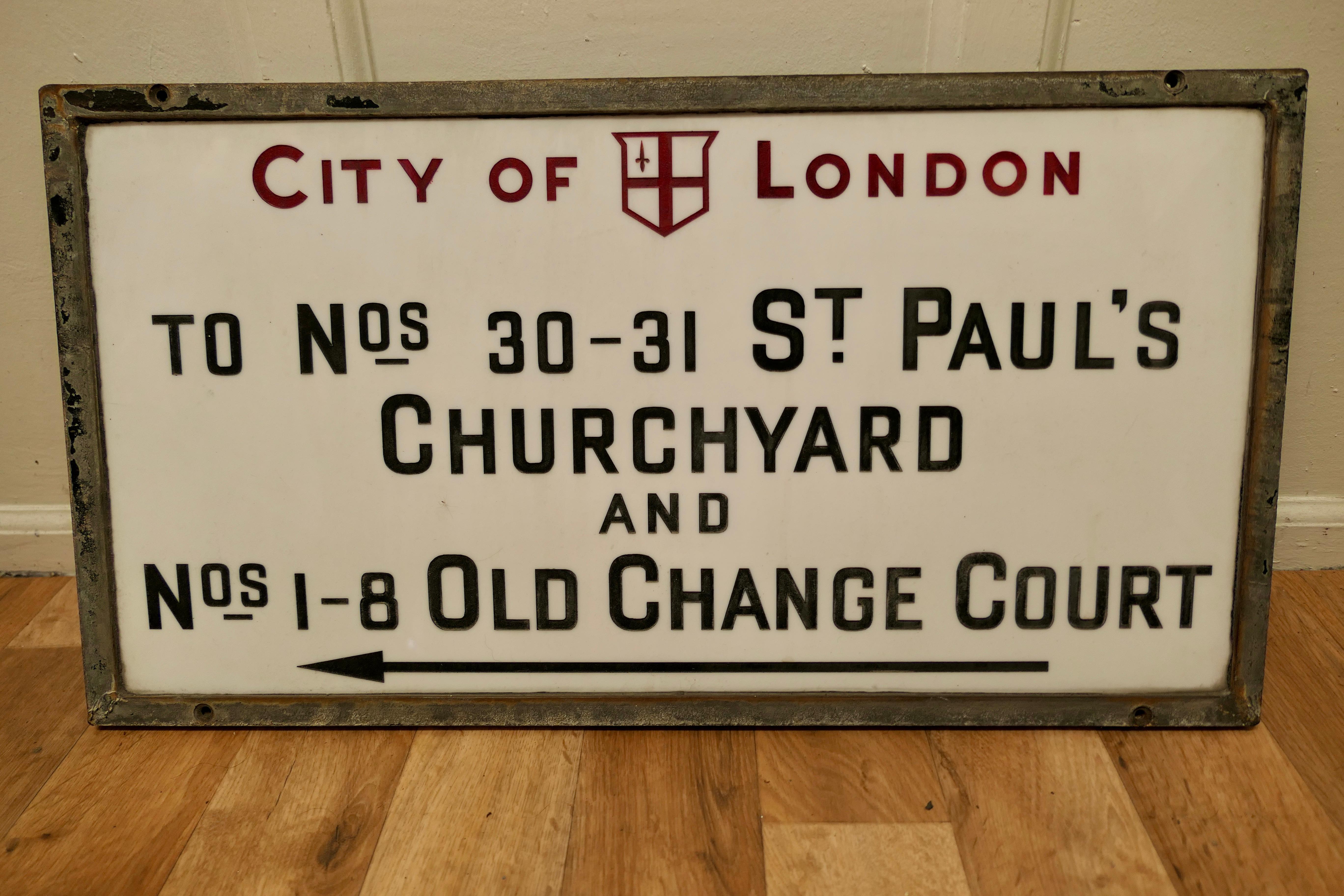 St Paul’s Churchyard, City of London glass Edwardian Street Sign

This is a City of London Street sign, it is set in its Cast Iron Frame, it is made in etched Vitrolite Glass, the City Of London impressed in red and the other characters are